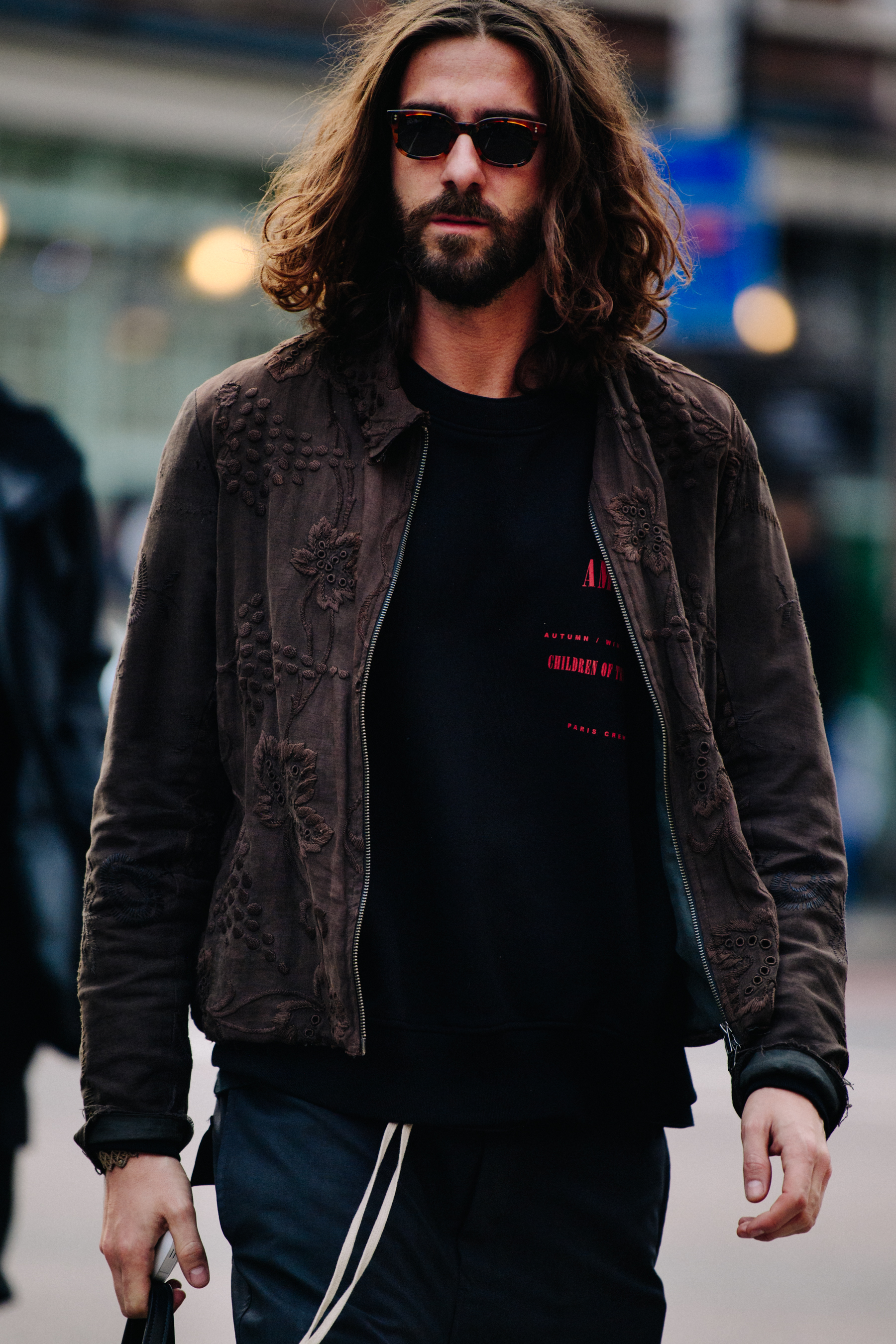 Man wearing brown jacket