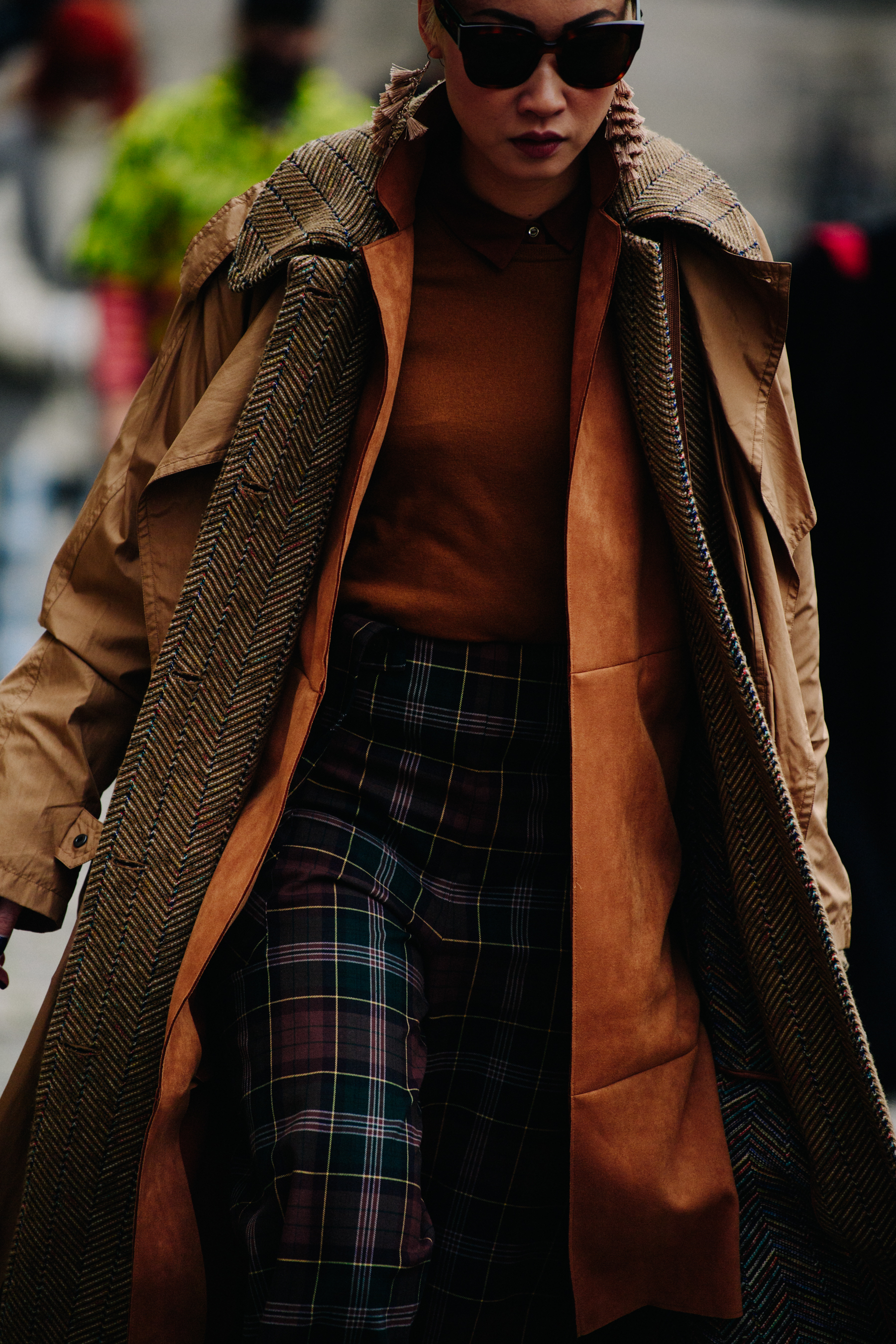 Woman wearing long orange coat