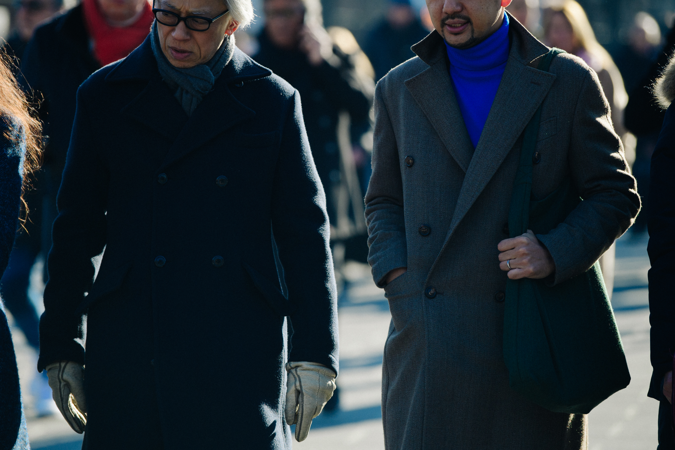 Two men wearing thick coats