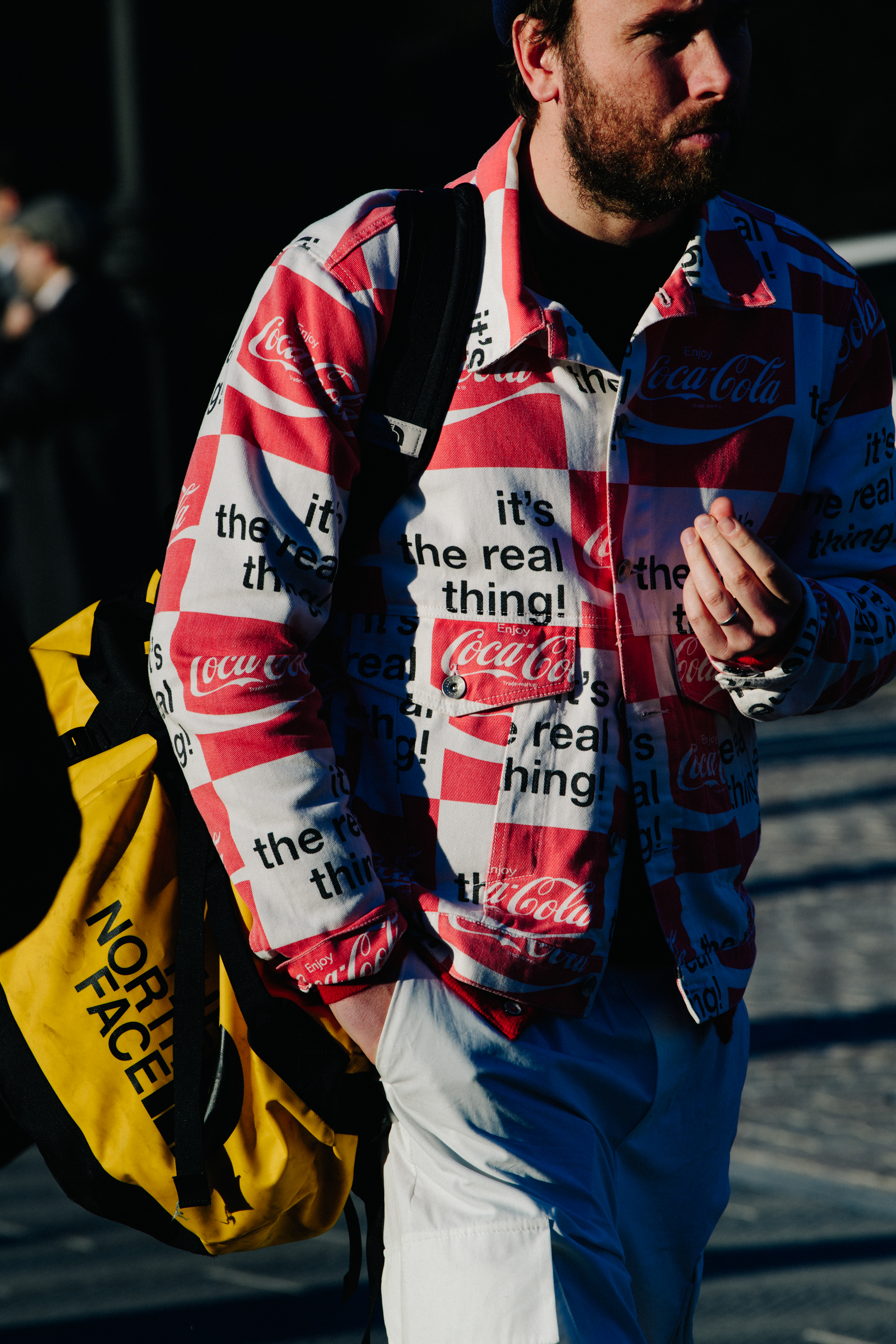 Man wearing Coca-Cola jacket