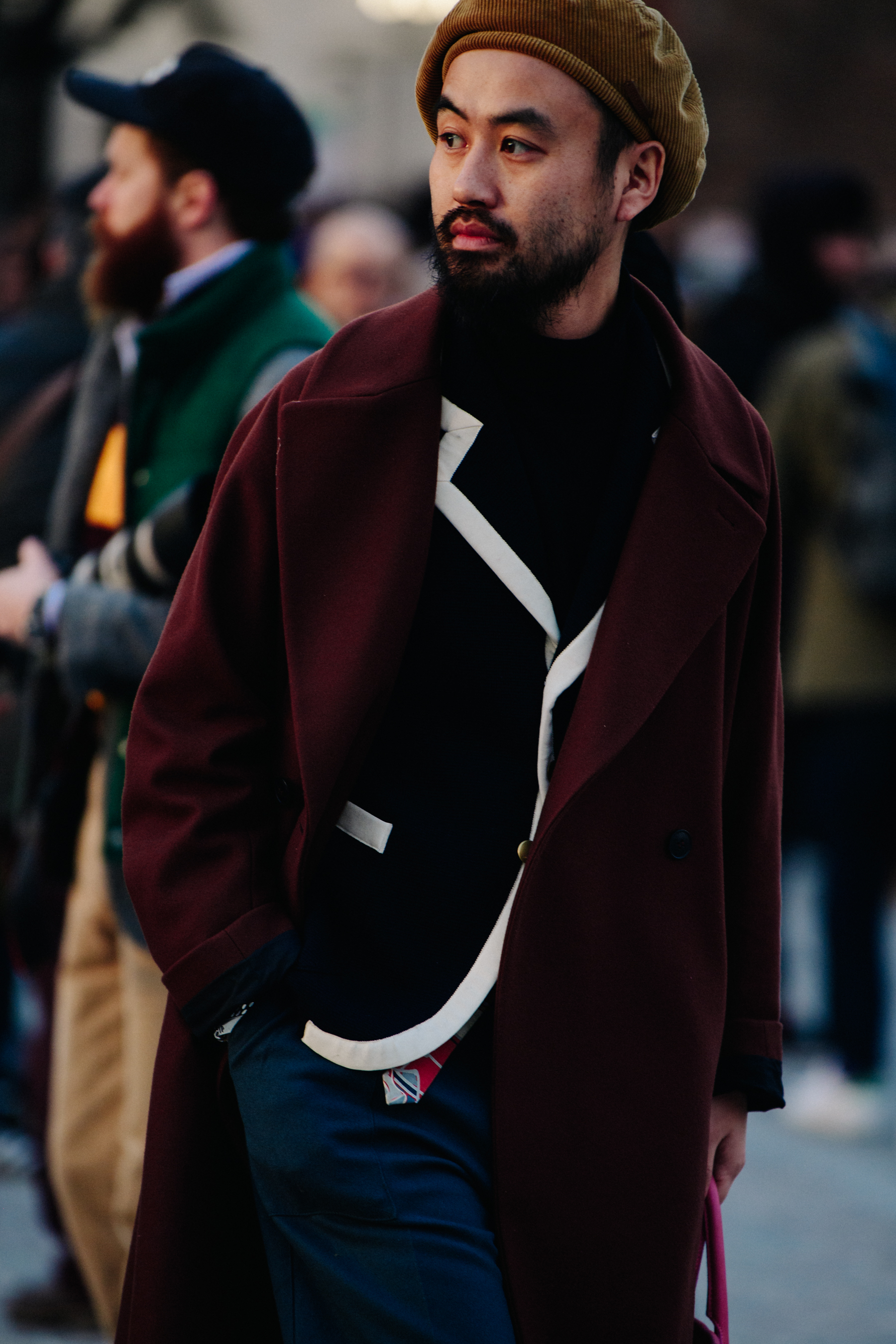 Man wearing dark red coat