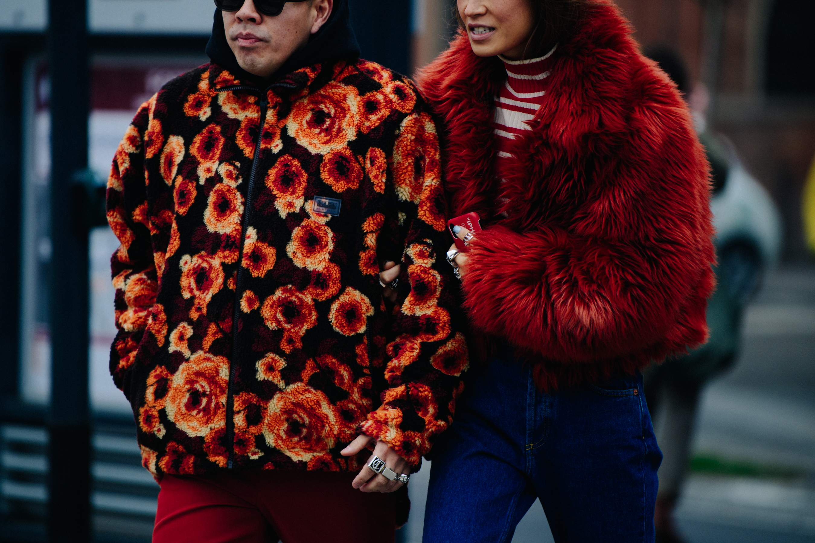 Couple wearing orange furry jackets