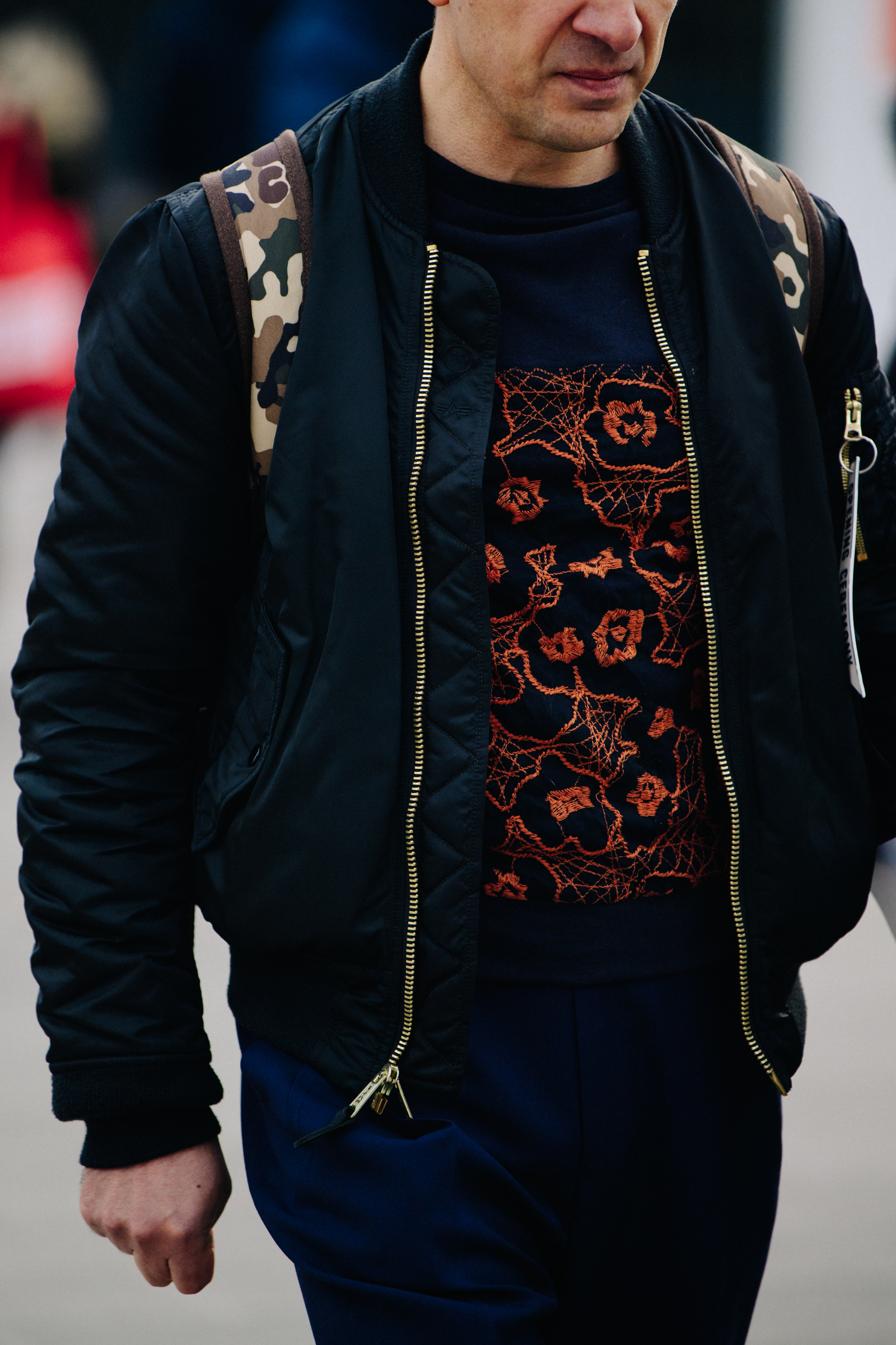 Man wearing black bomber jacket