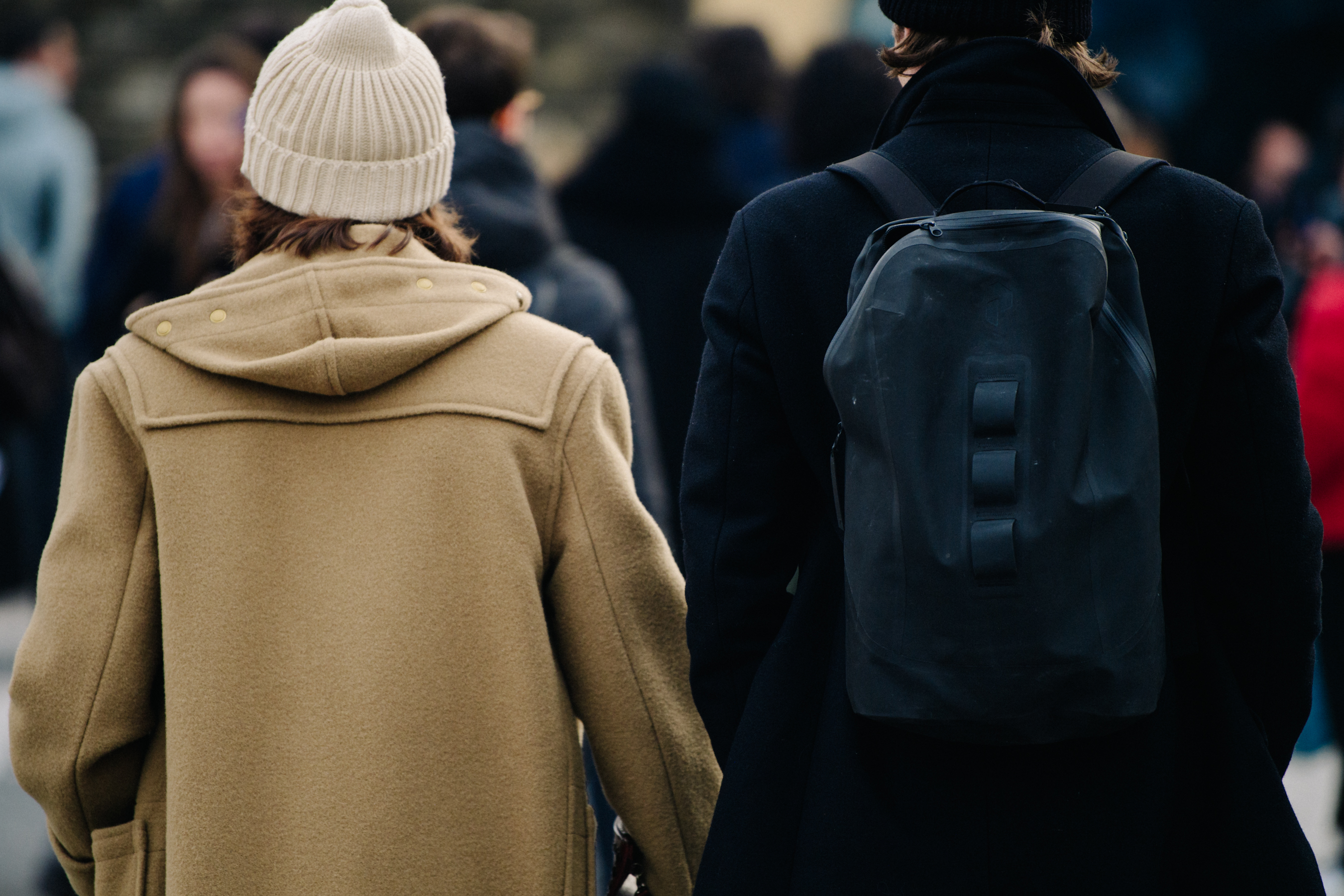 Two men wearing black and tan wool