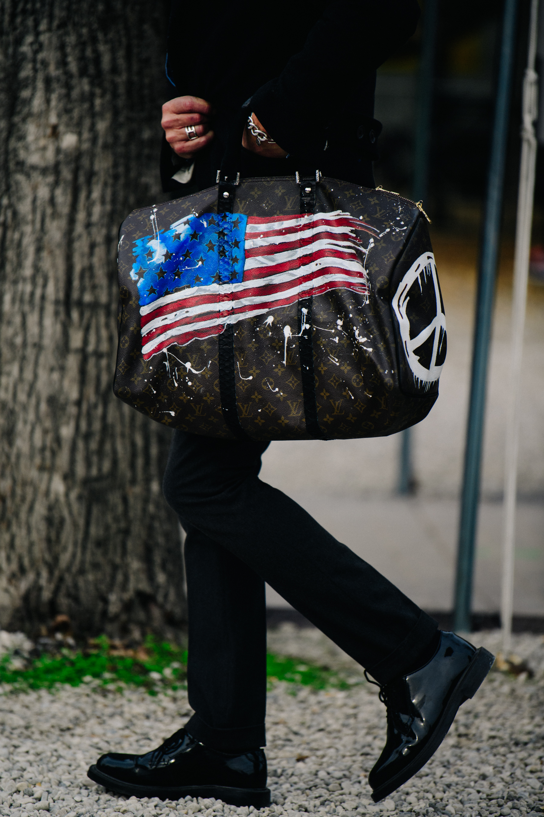 Man carrying Louis Vuitton bag