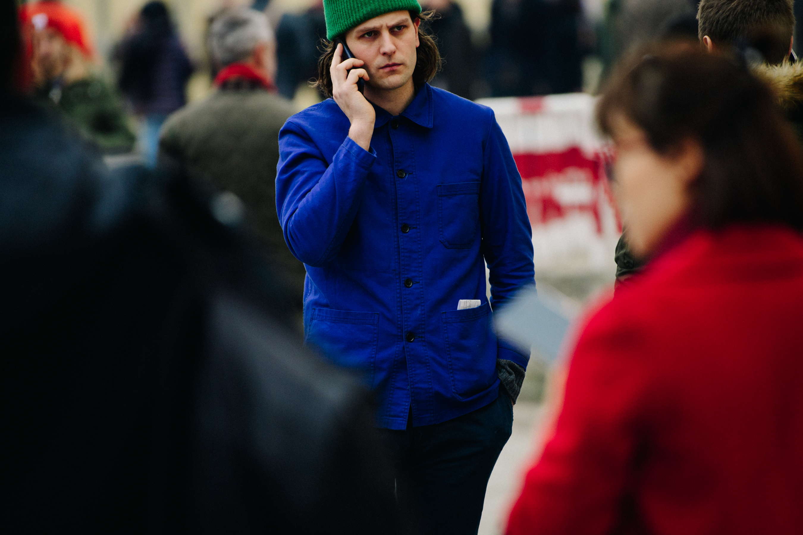 Man wearing blue painters jacket