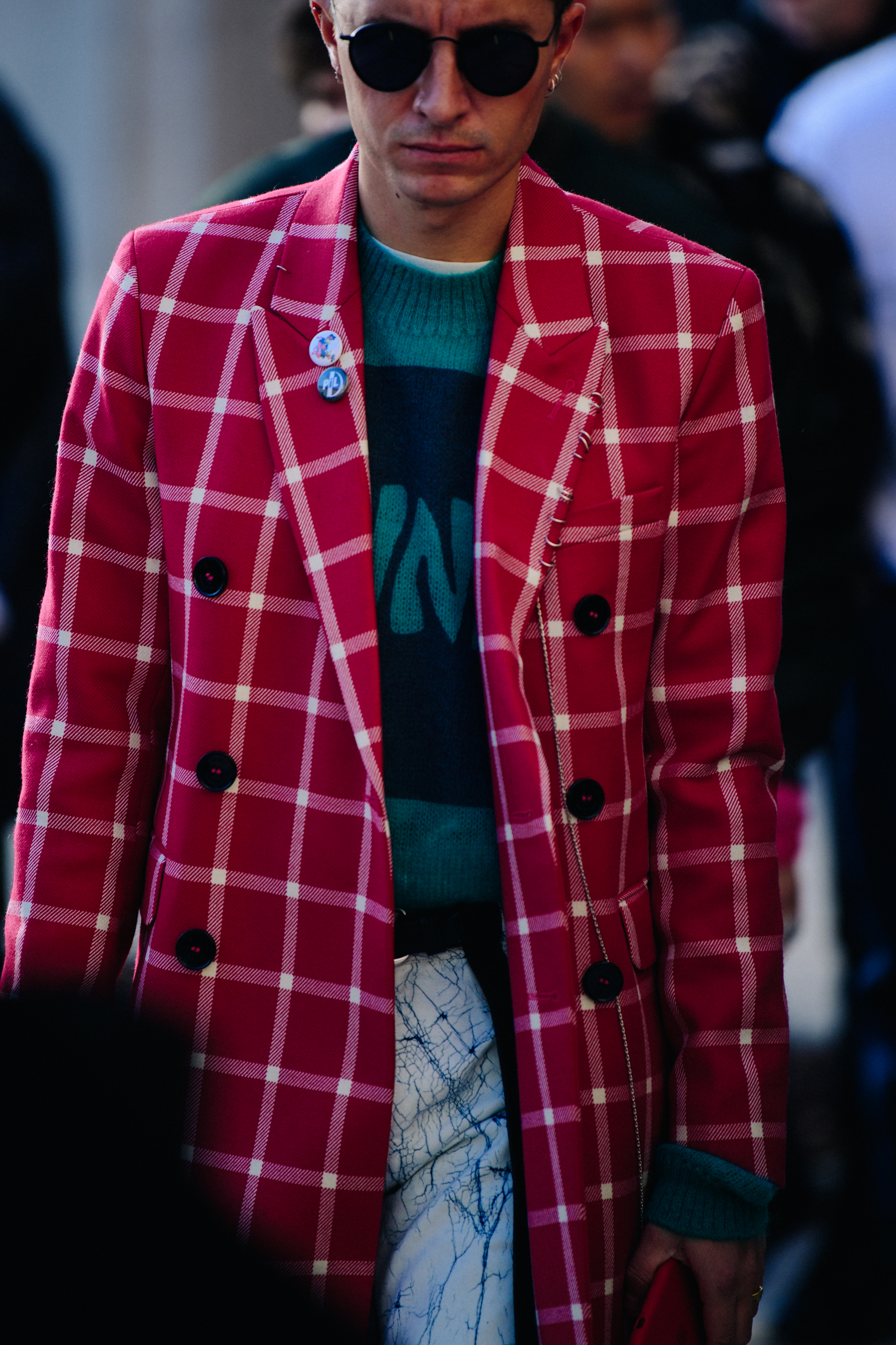 Man wearing red check coat