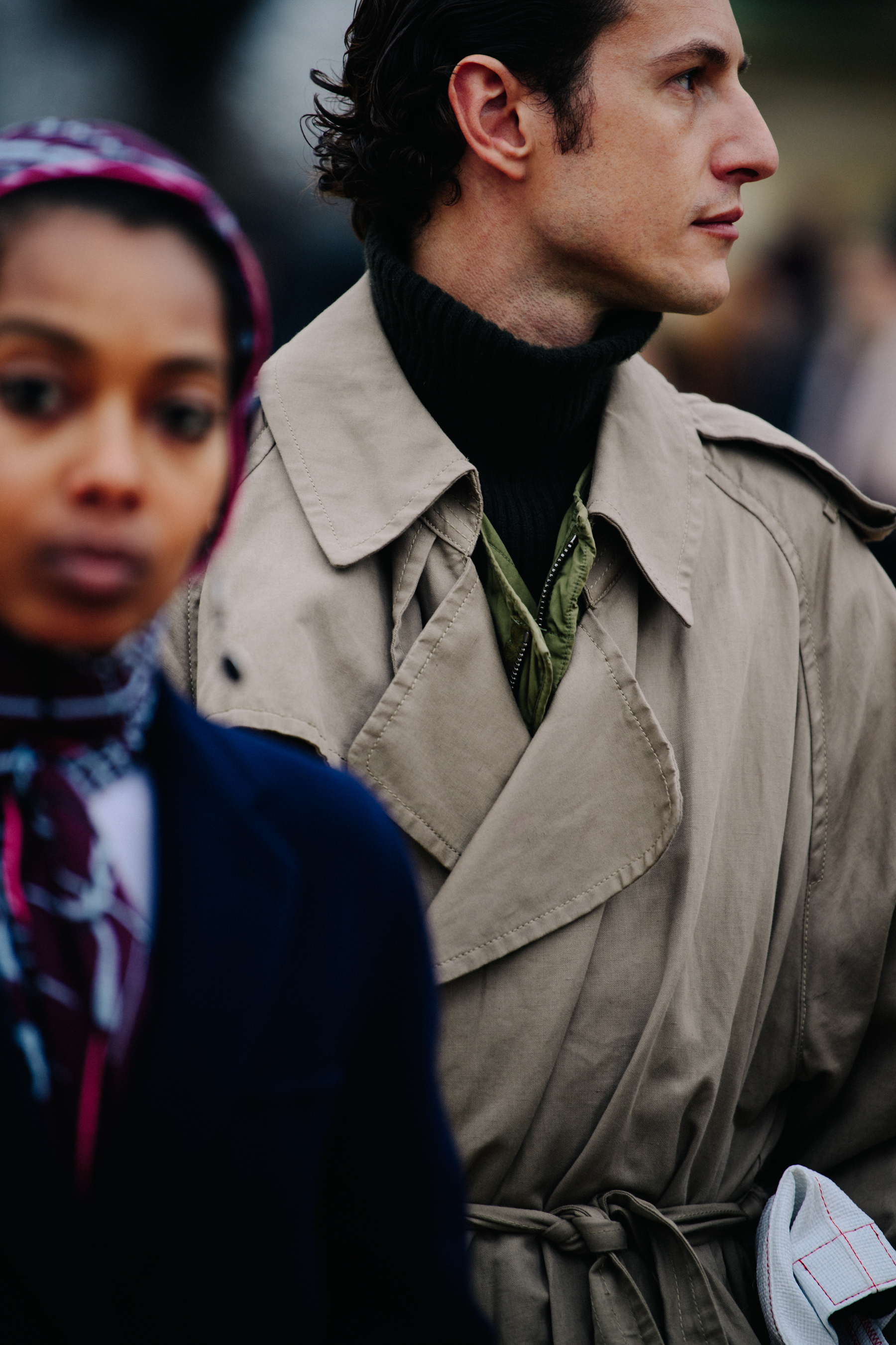 Man wearing light coat