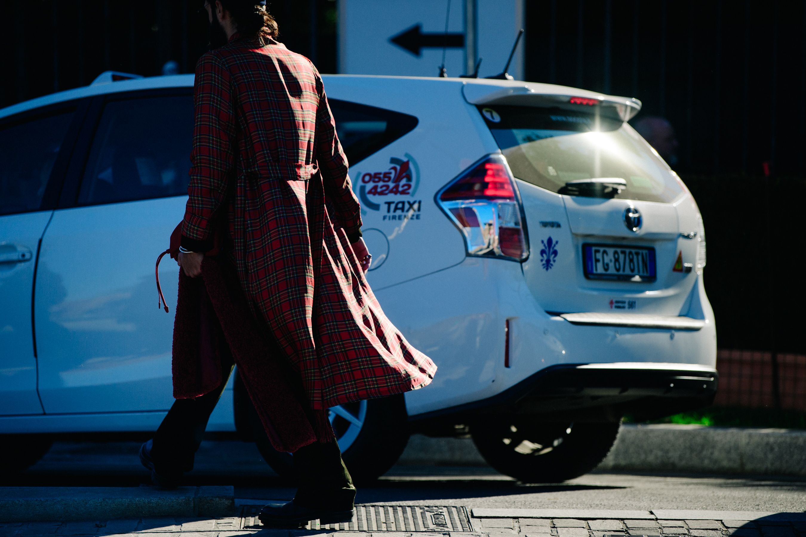 Woman wearing red check coat