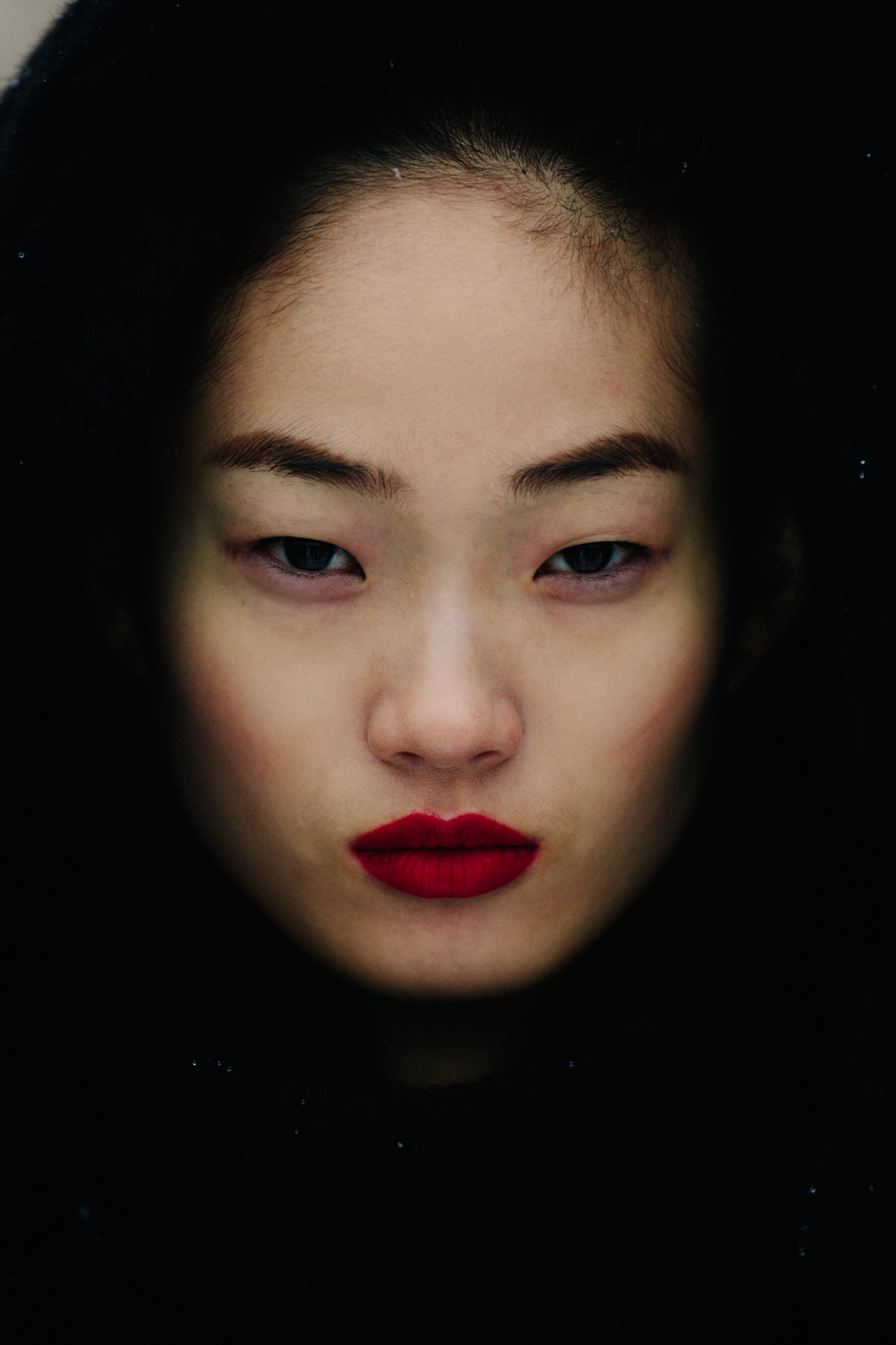 Portrait of Chinese model wearing red lipstick
