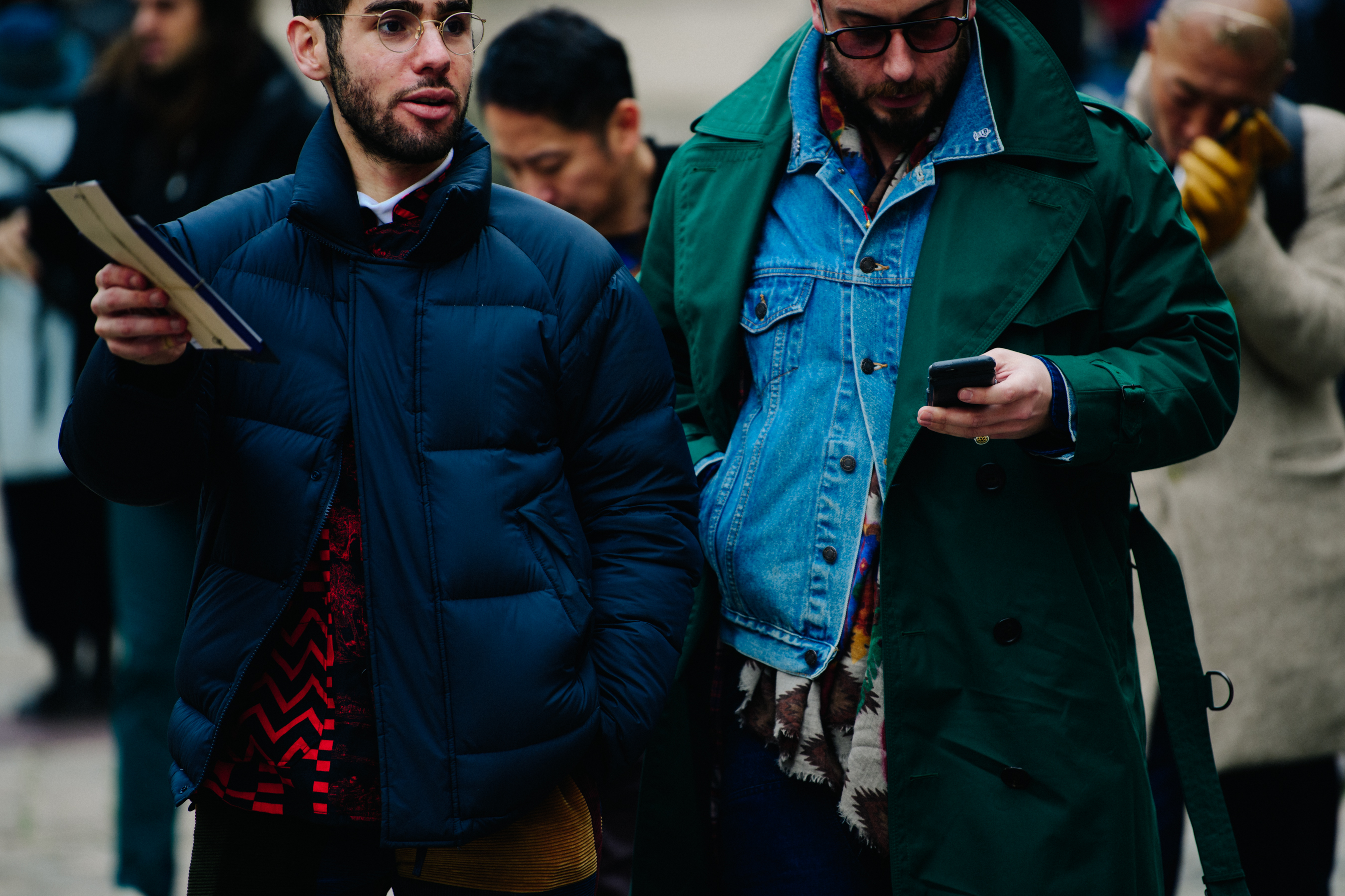 Two men wearing blue