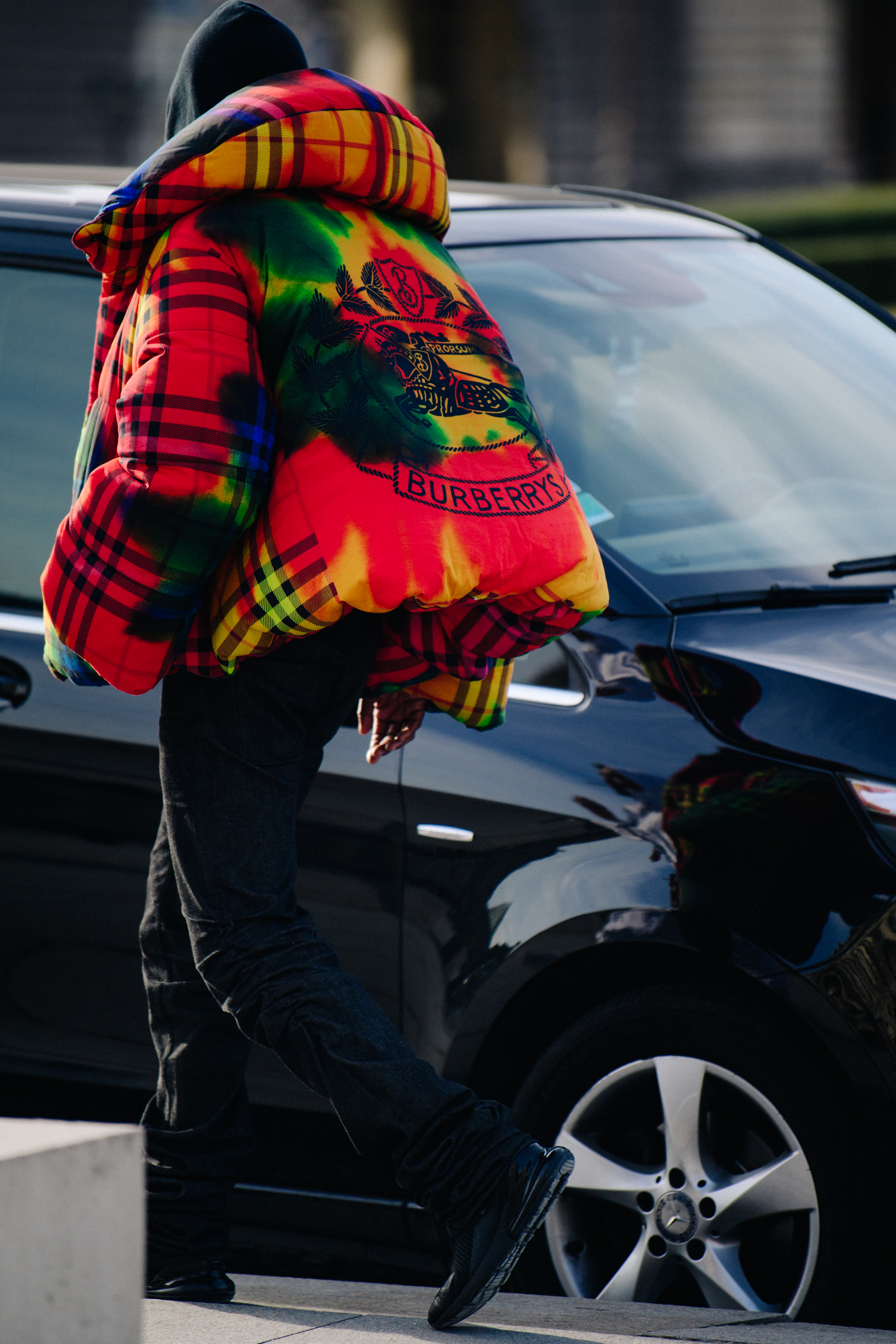 Skepta wearing colourful coat