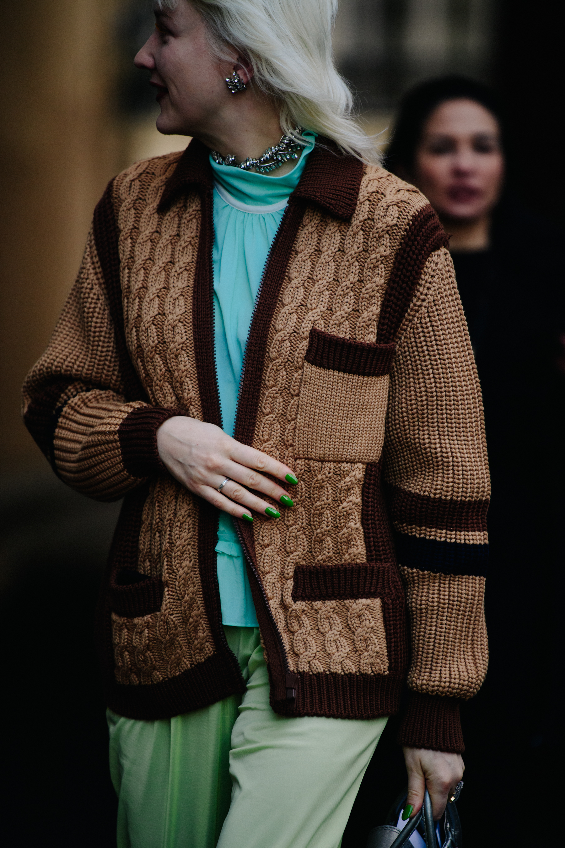 Stylist wearing brown cardigan