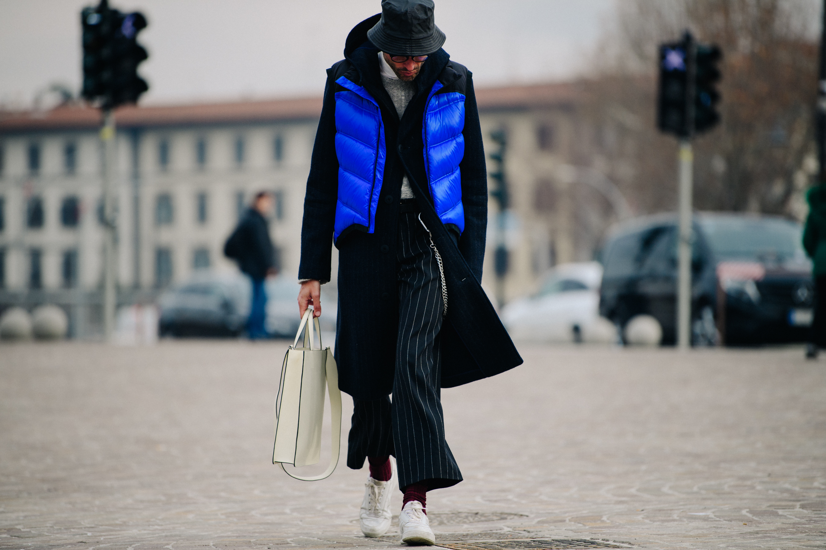 Man wearing blue vest