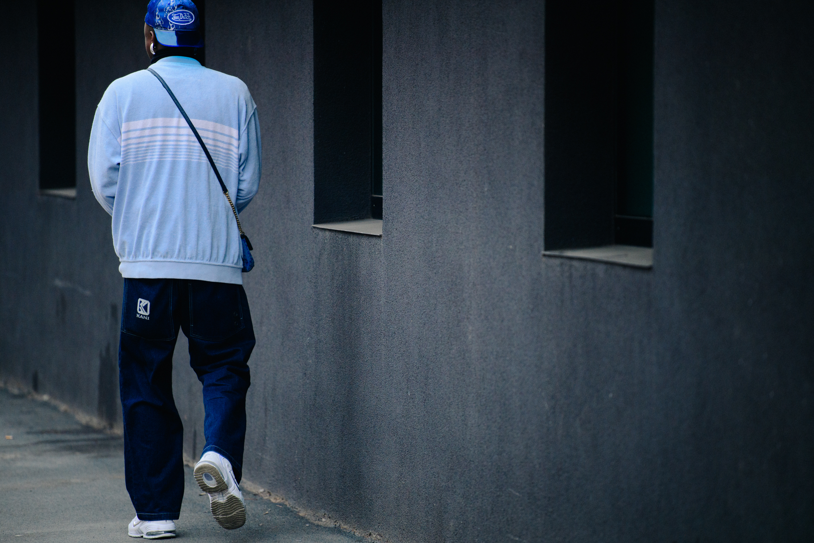 French man wearing blue outfit