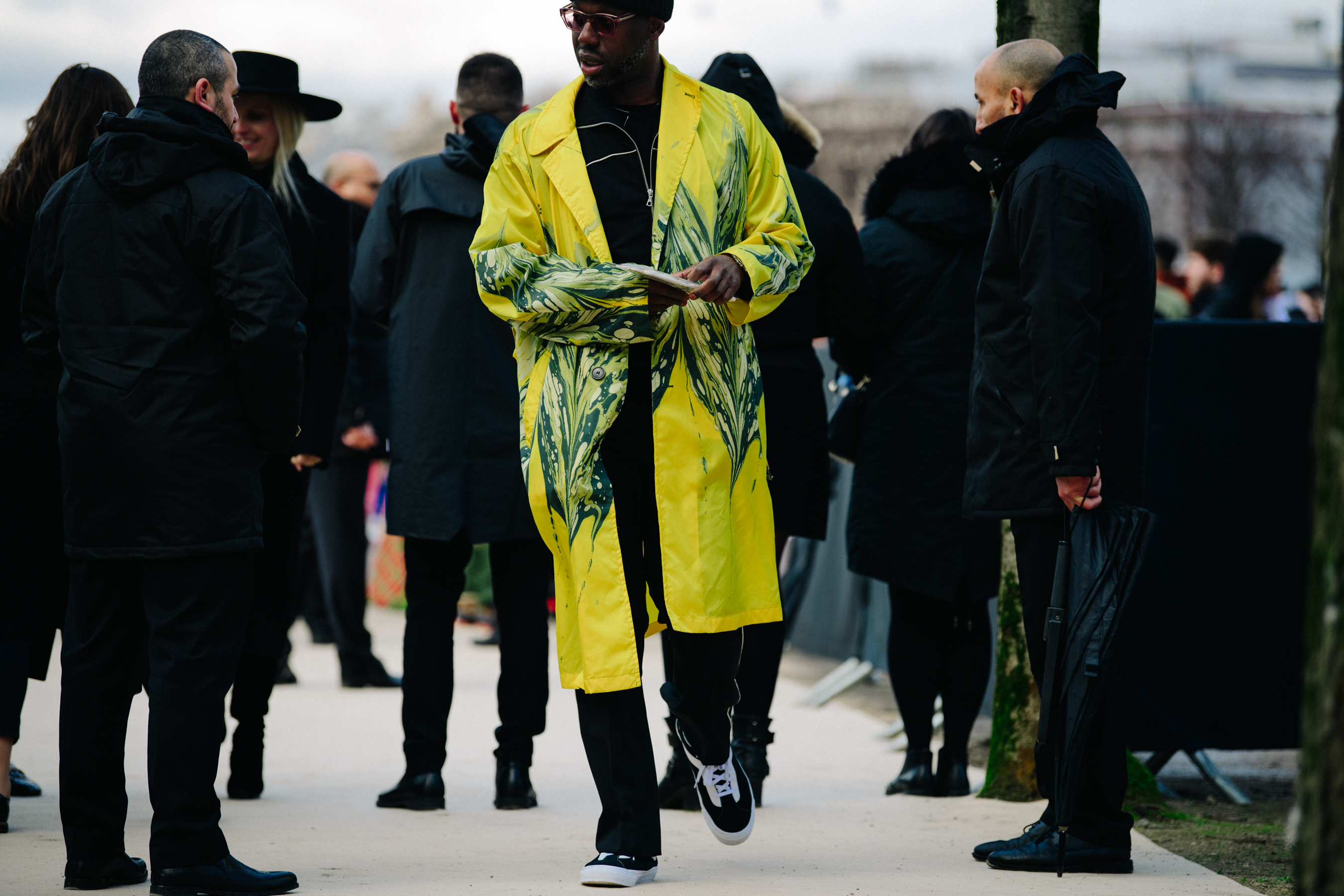 Man wearing yellow coat