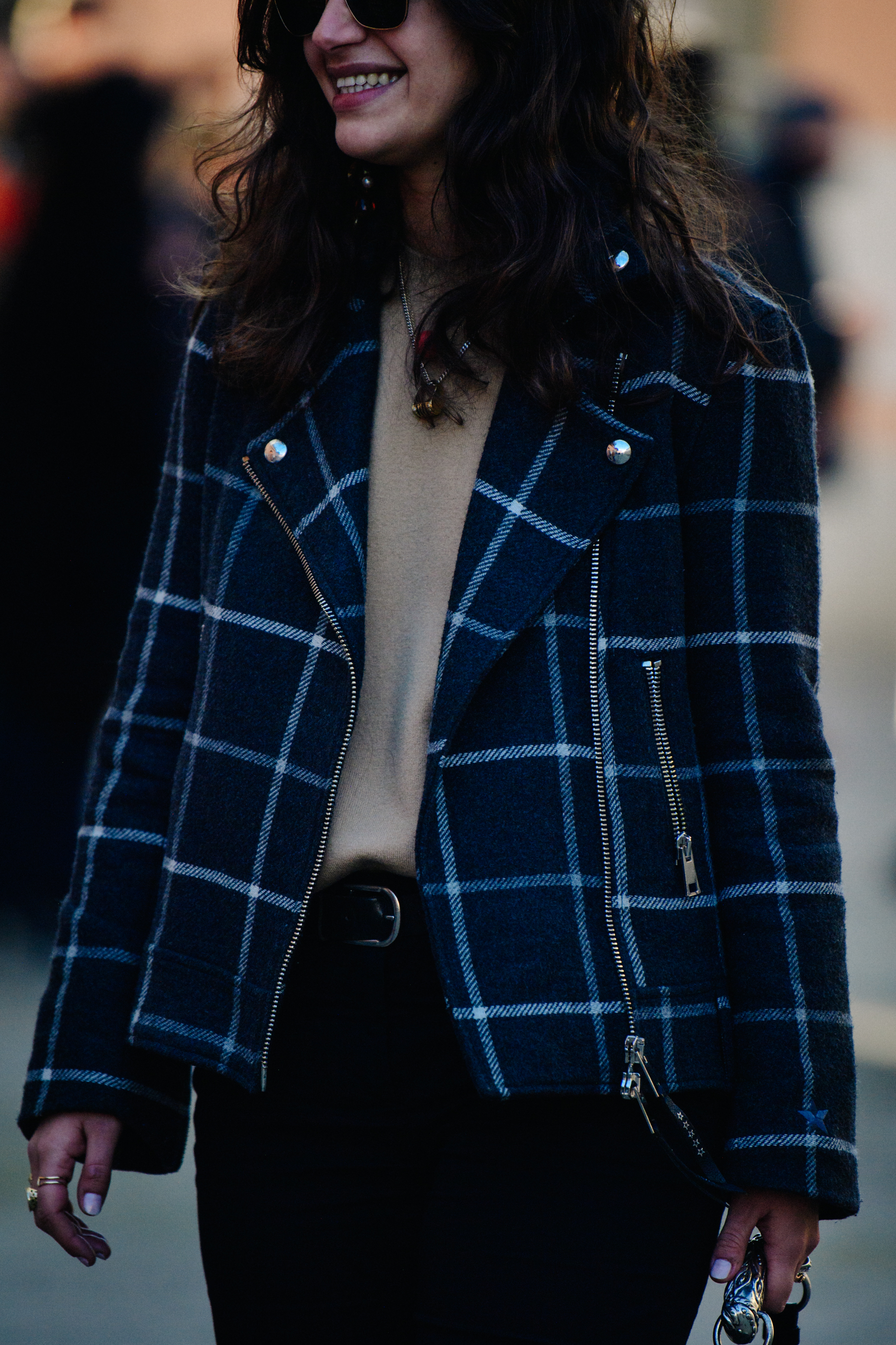 Woman wearing blue check jacket