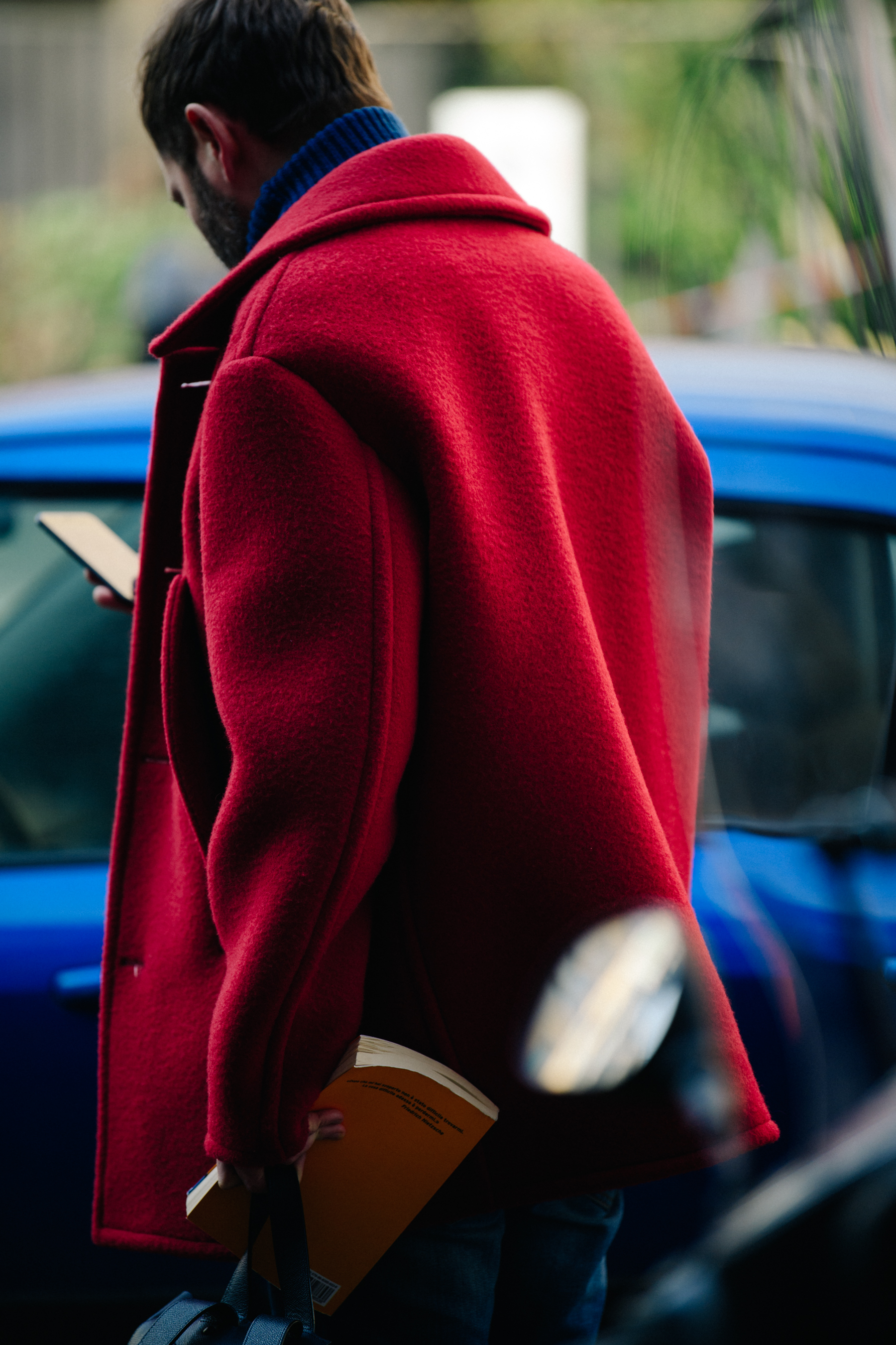 Man wearing Raf Simons coat