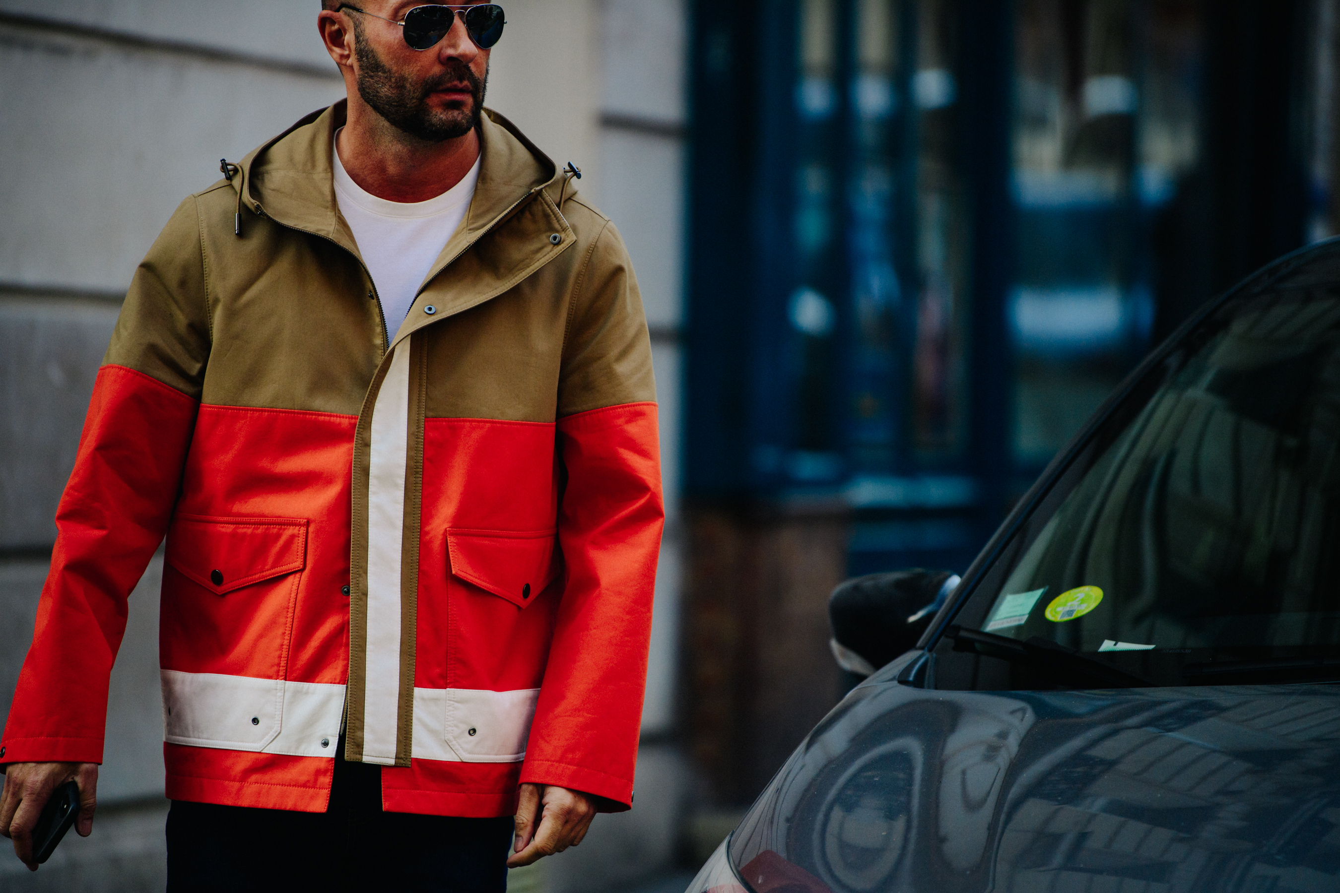 Man wearing orange coat