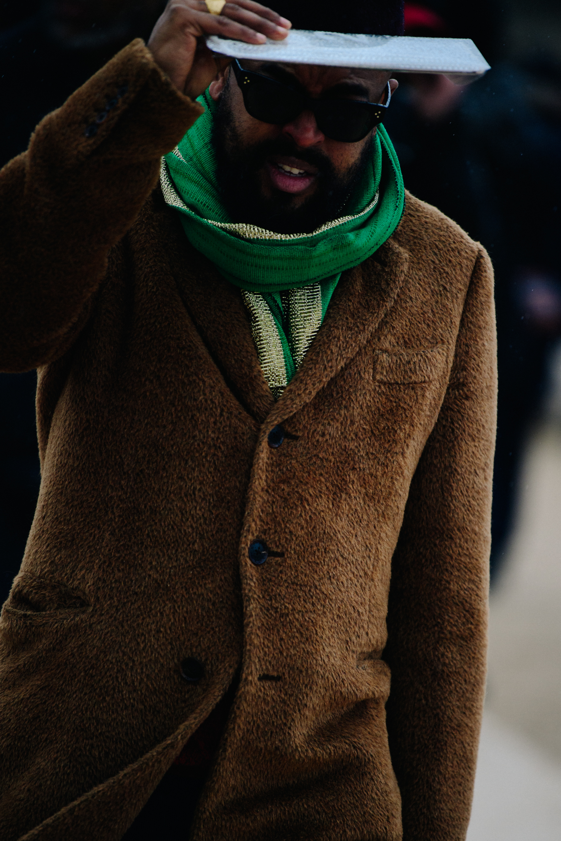 Man wearing brown coat