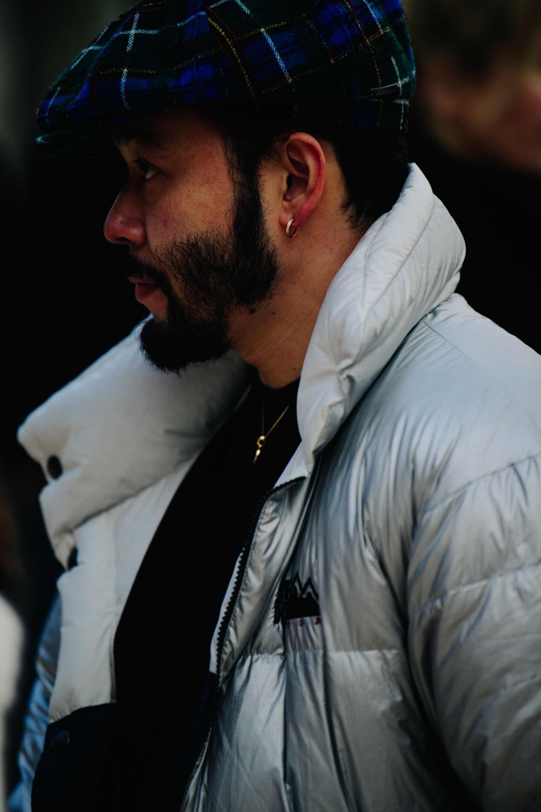 Man wearing blue flatcap