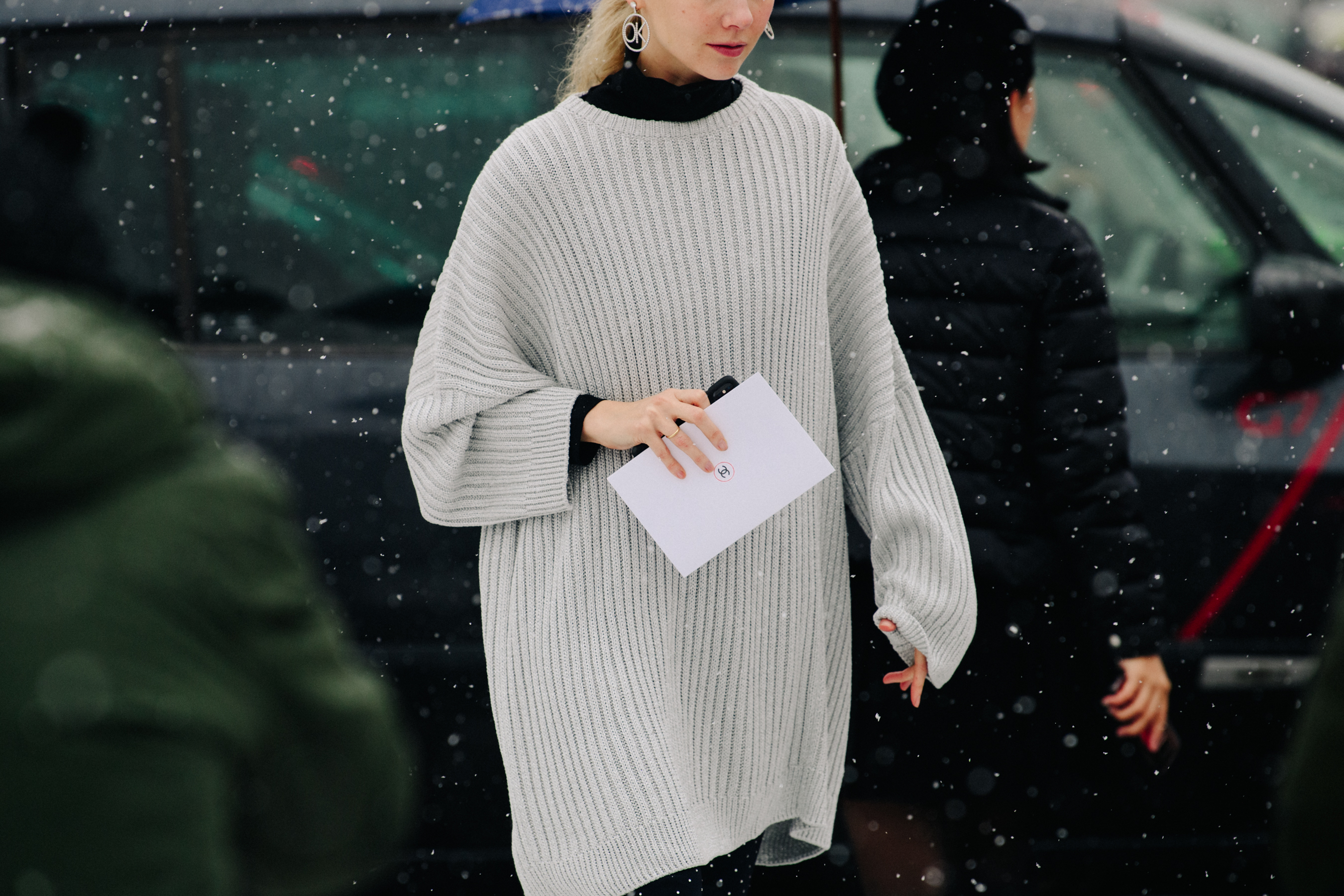 Russian woman wearing white jumper