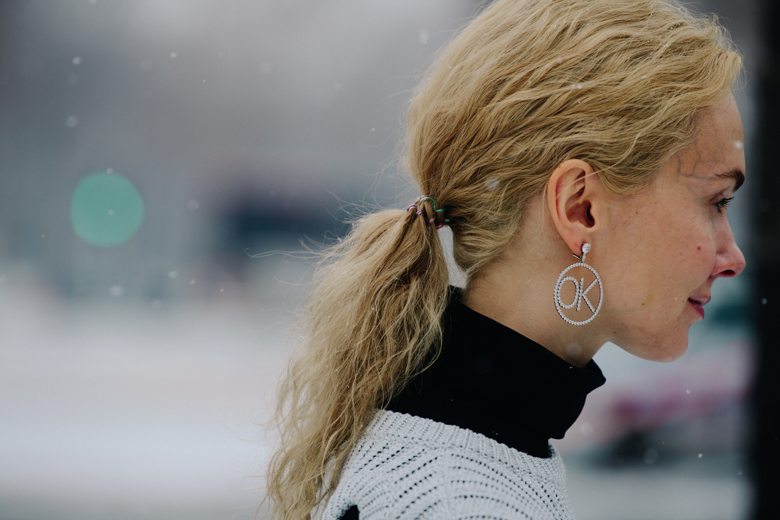 Russian woman wearing white jumper