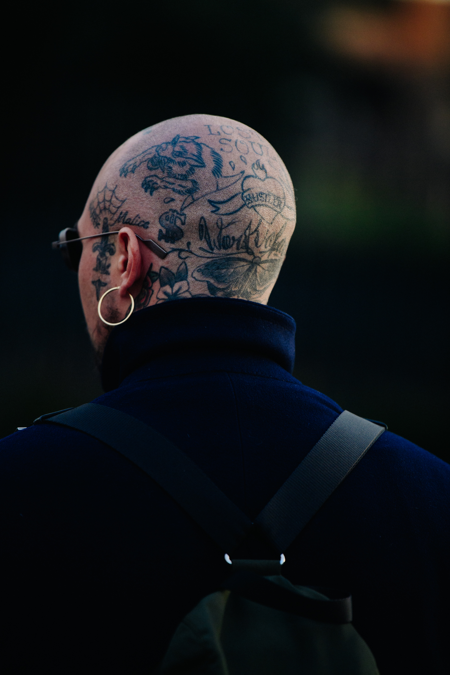 Man with tattoos on head