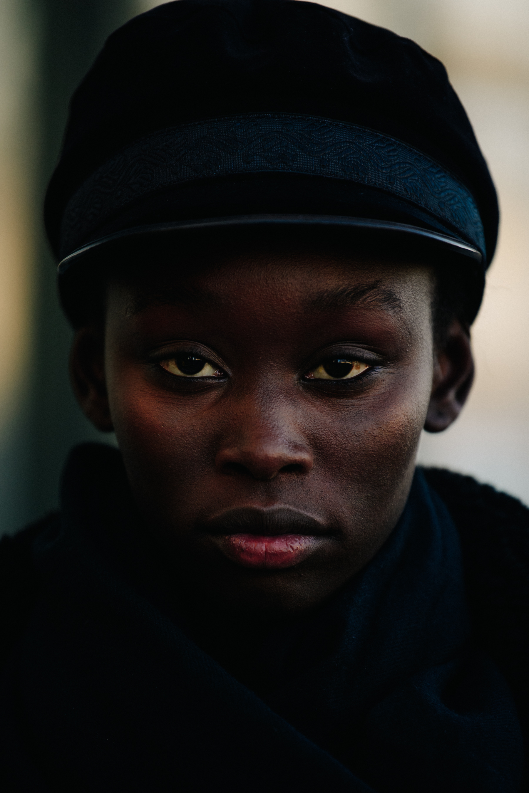 Portrait of model wearing black hat