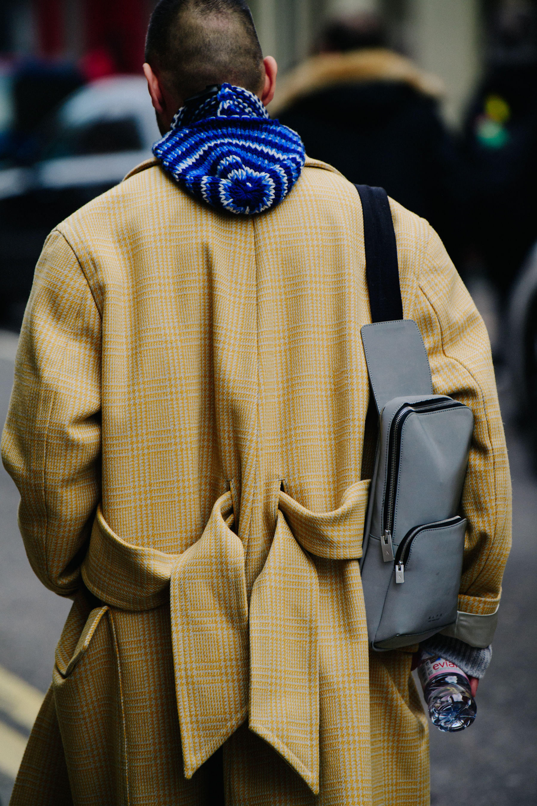 Man wearing yellow trench coat