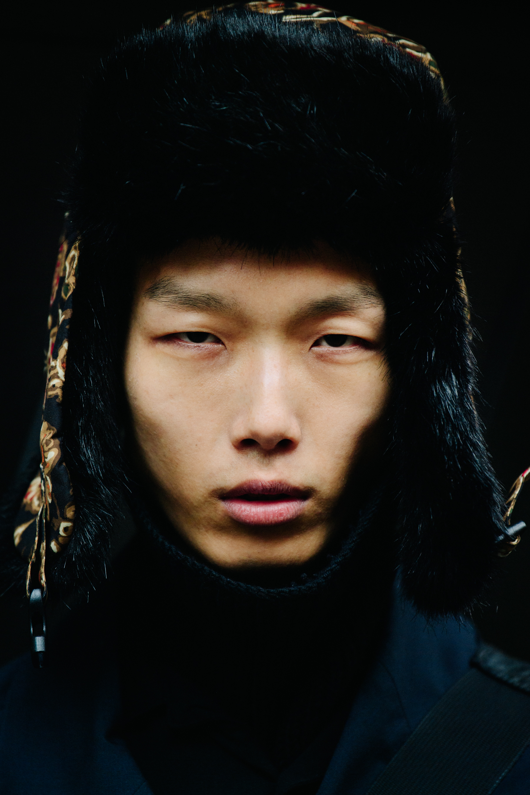 Portrait of model wearing fur hat