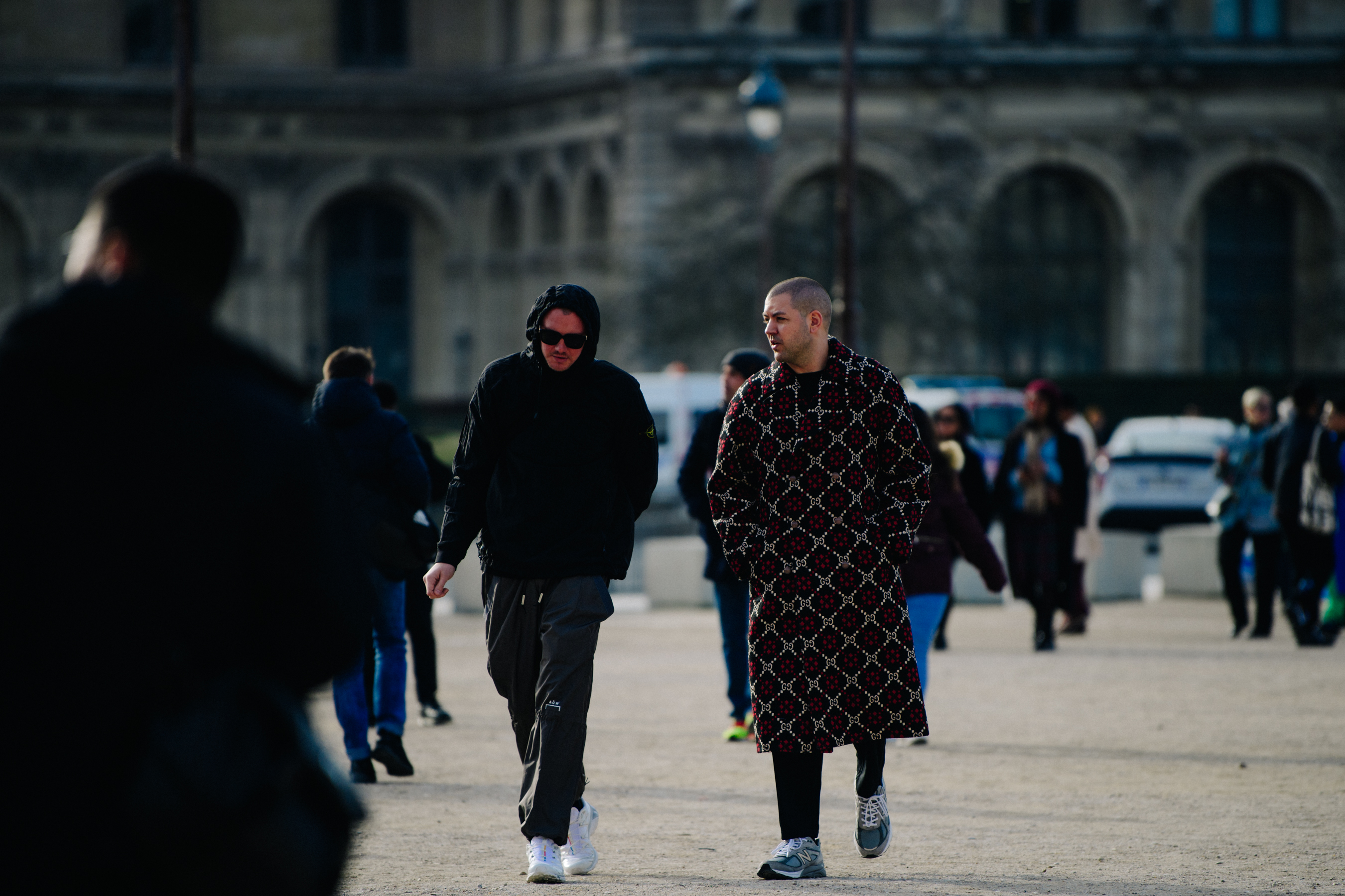 Two men wearing dark clothing