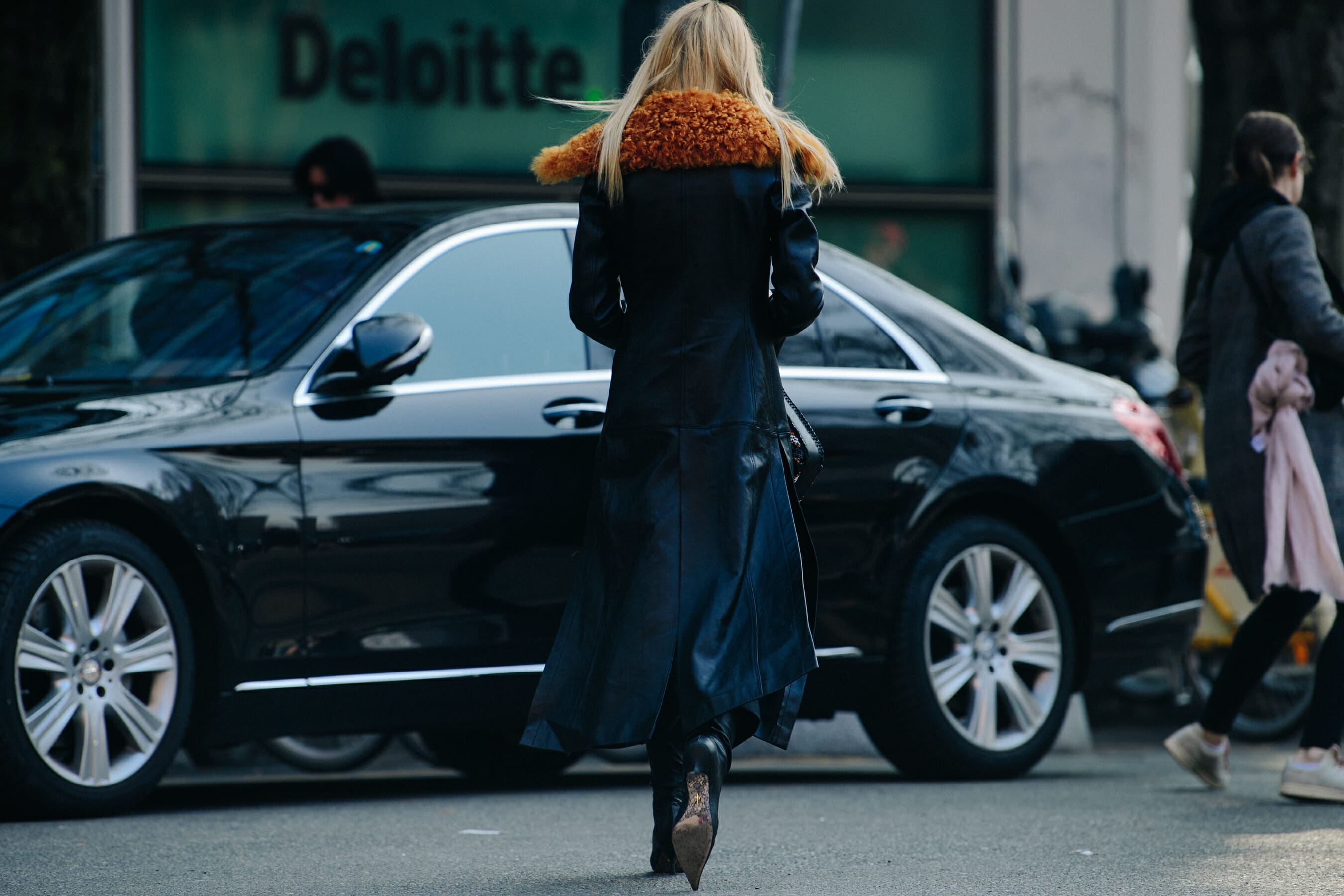 Woman wearing long black coat
