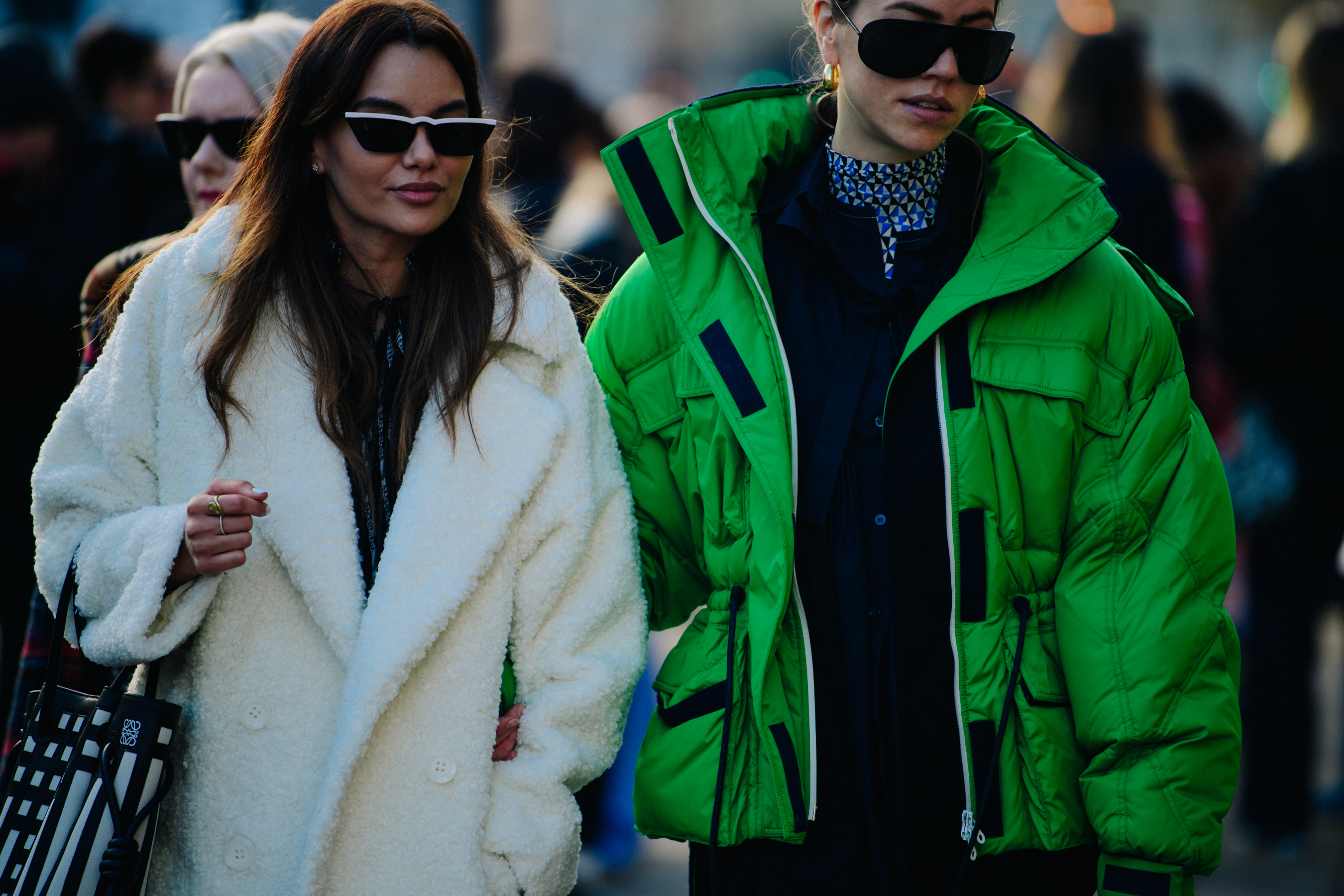 Two women wearing winetr coats