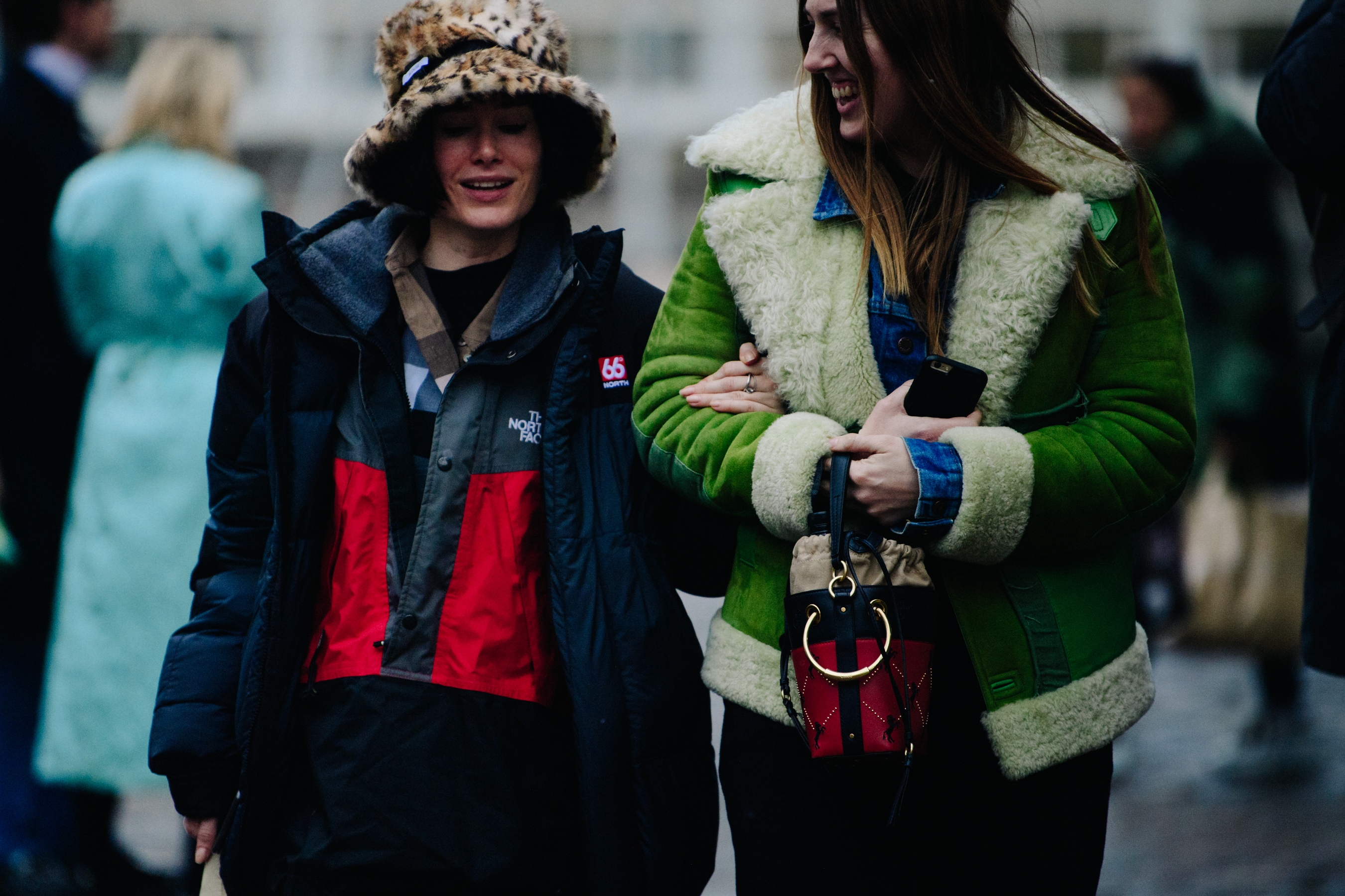 Two women wearing fur