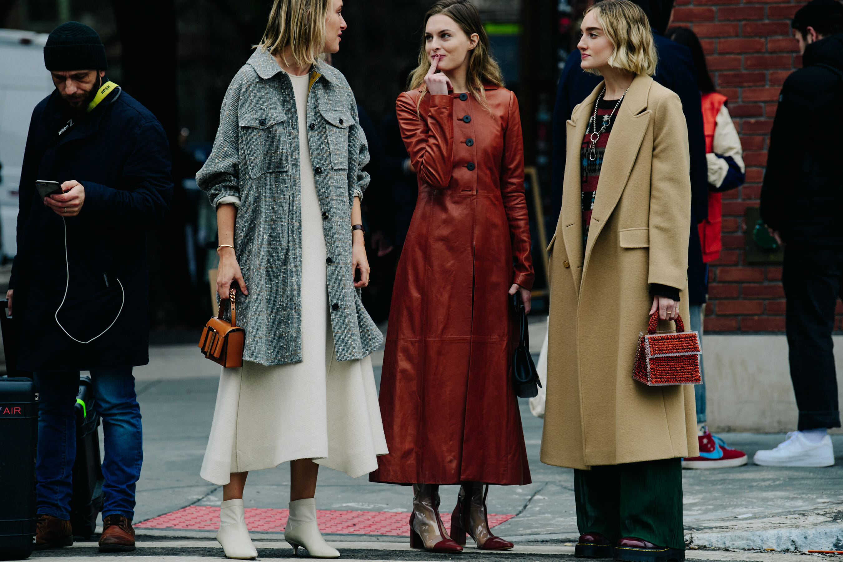 Three women wearing winter coats