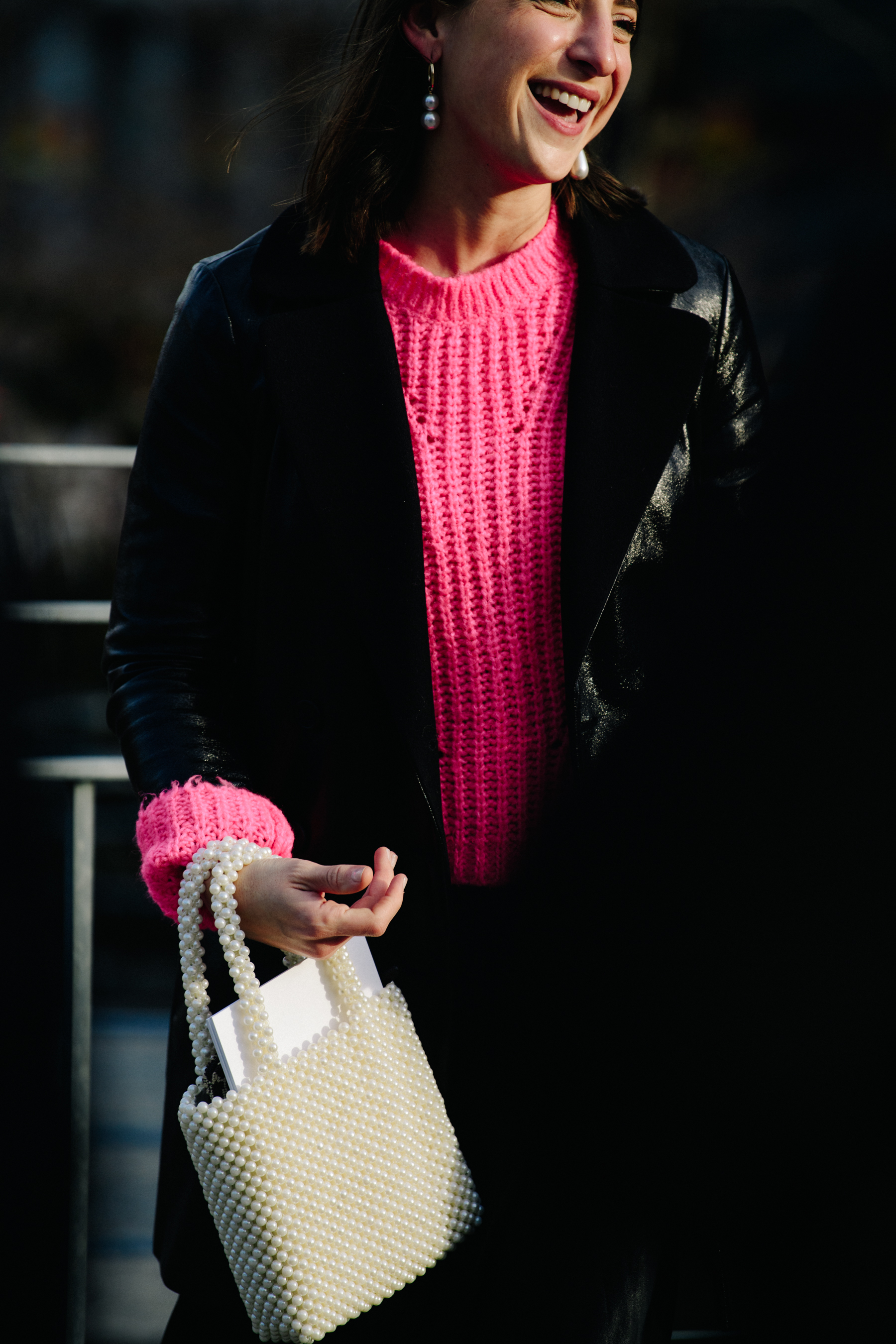 Woman wearing pink knitted jumper