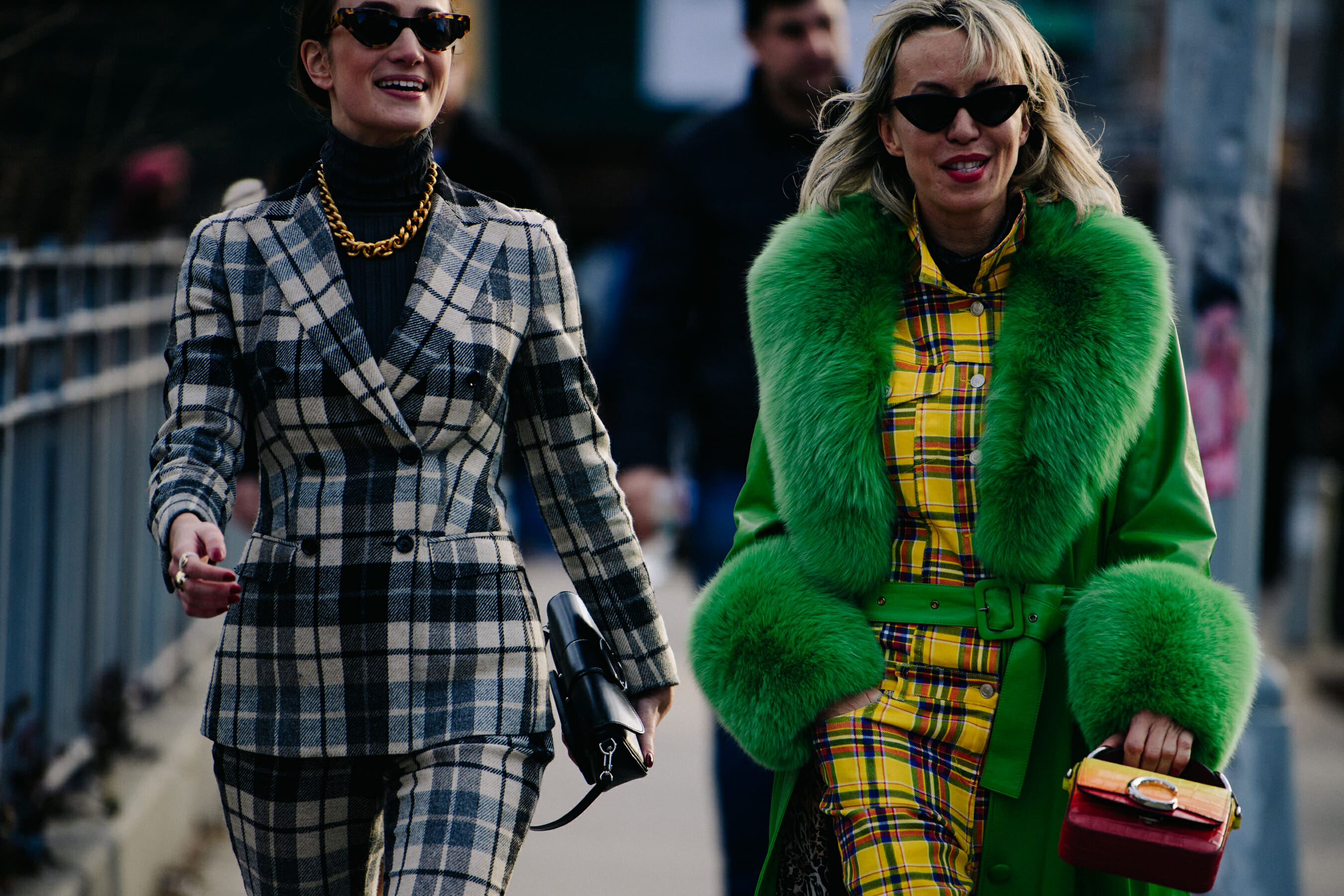 Two women wearing check outfits