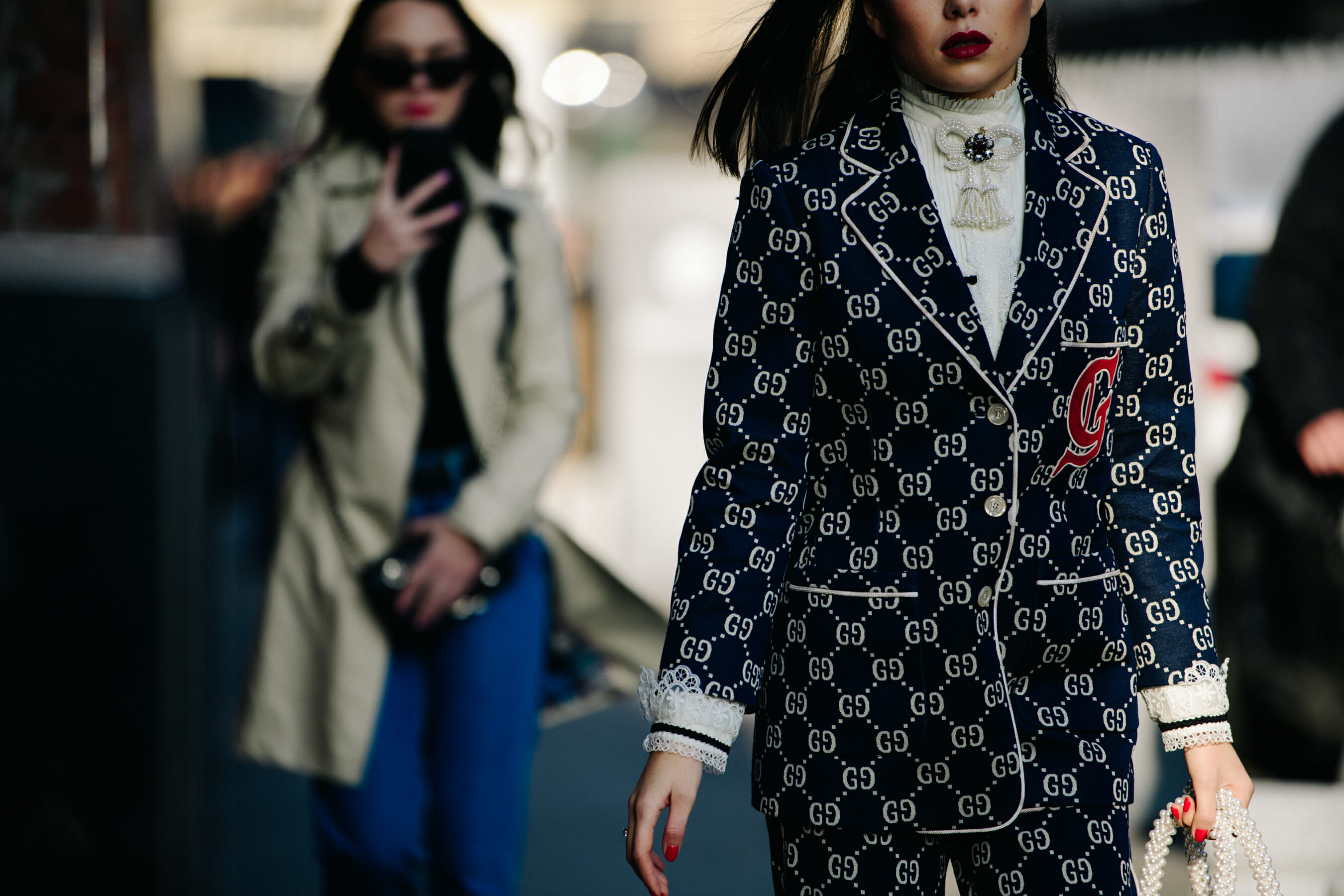 Woman wearing Gucci suit