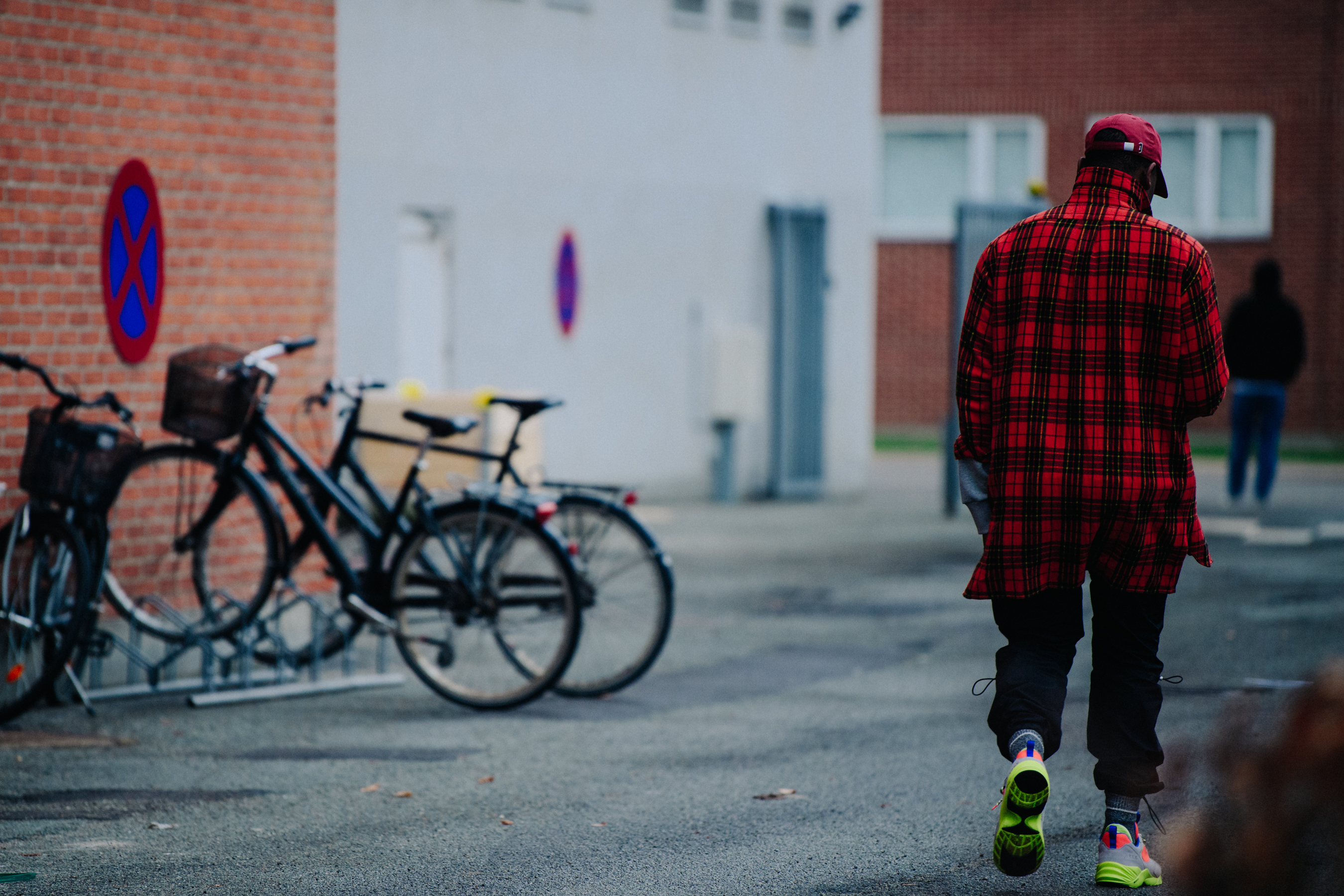 Man wearing red check coat