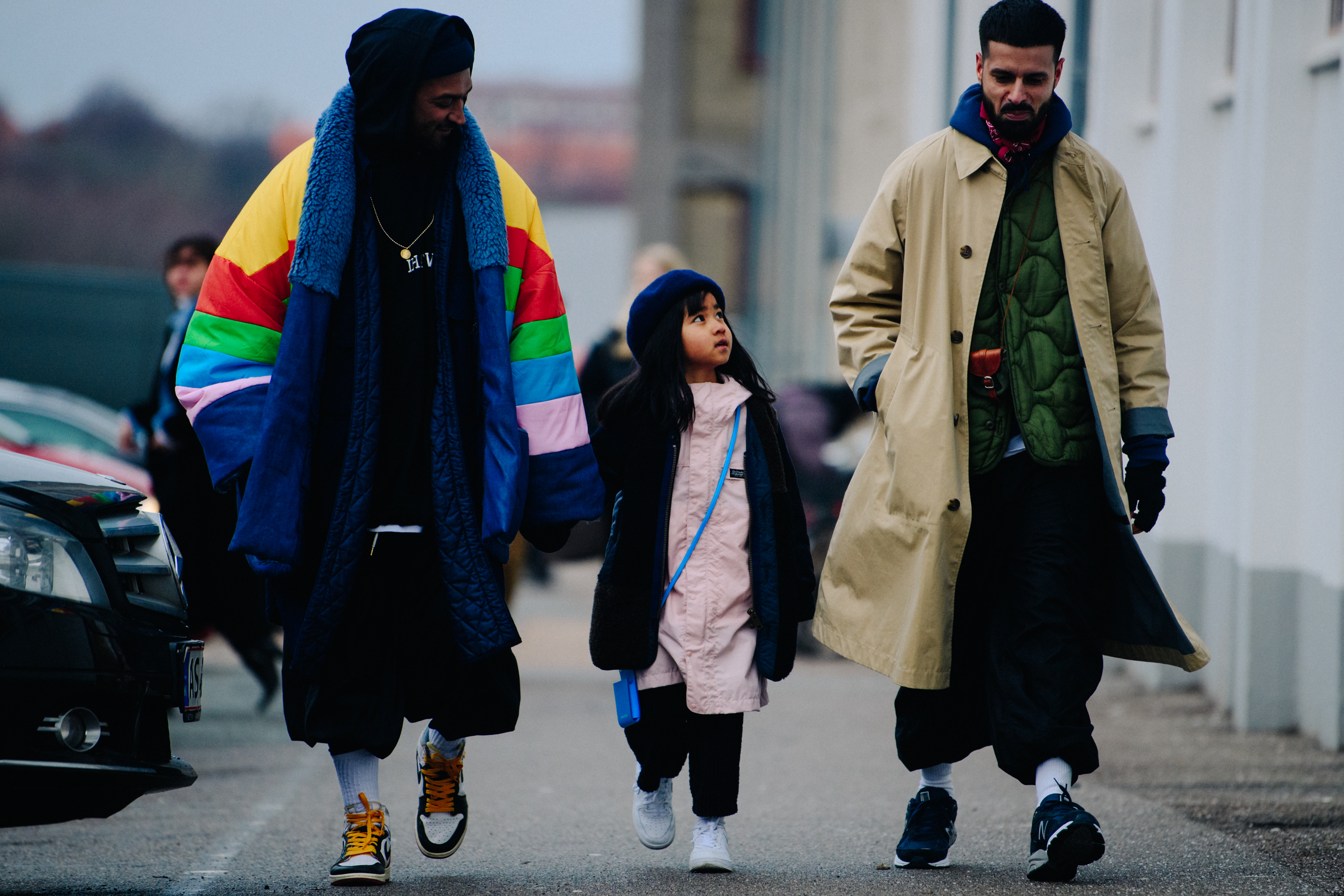 Two men with a little girl