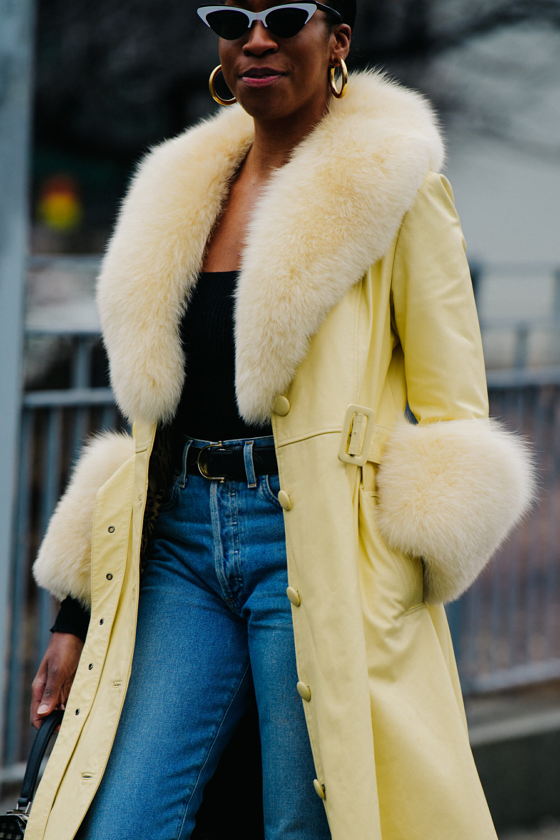 Woman wearing yellow fur coat