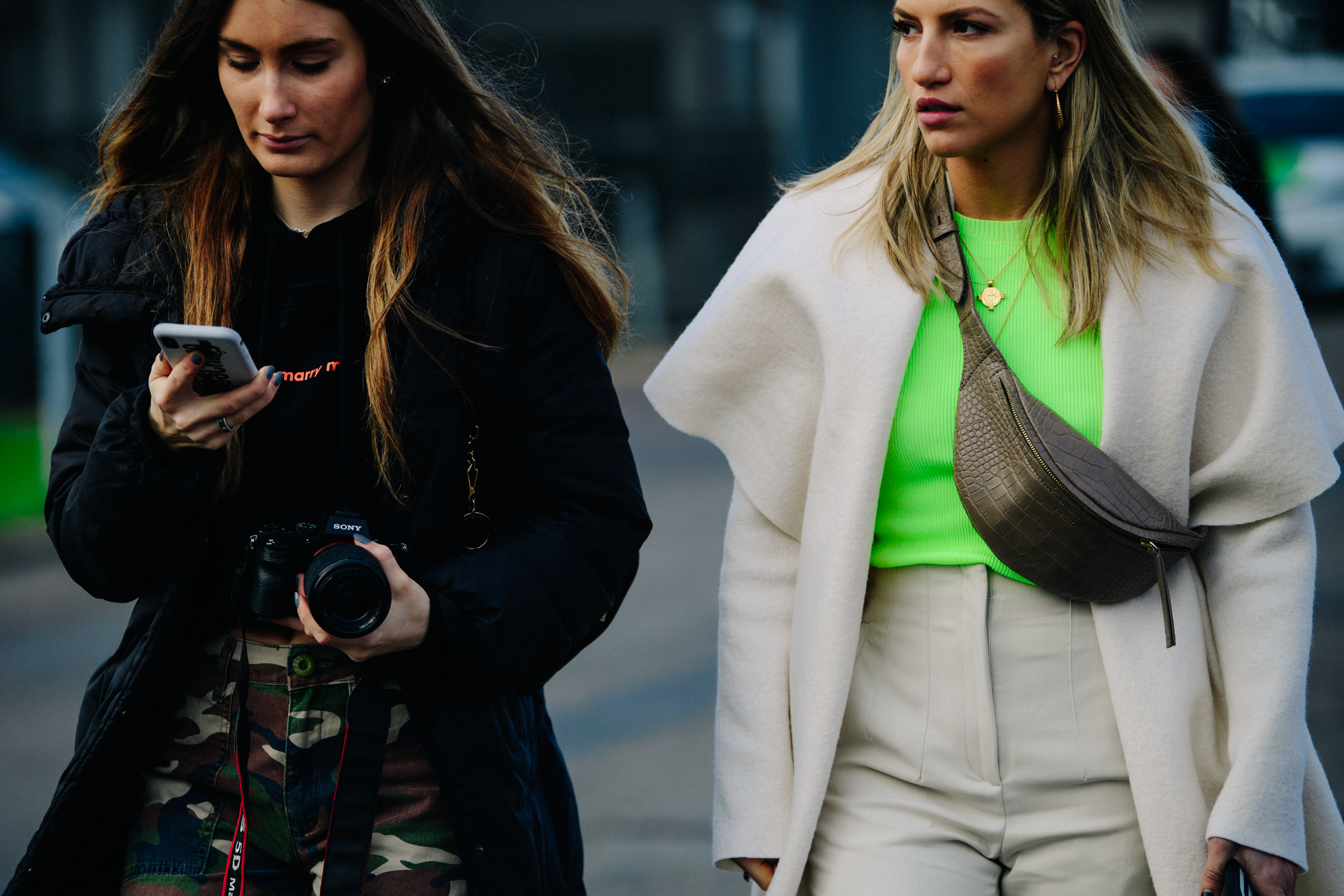 Two women wearing white and black