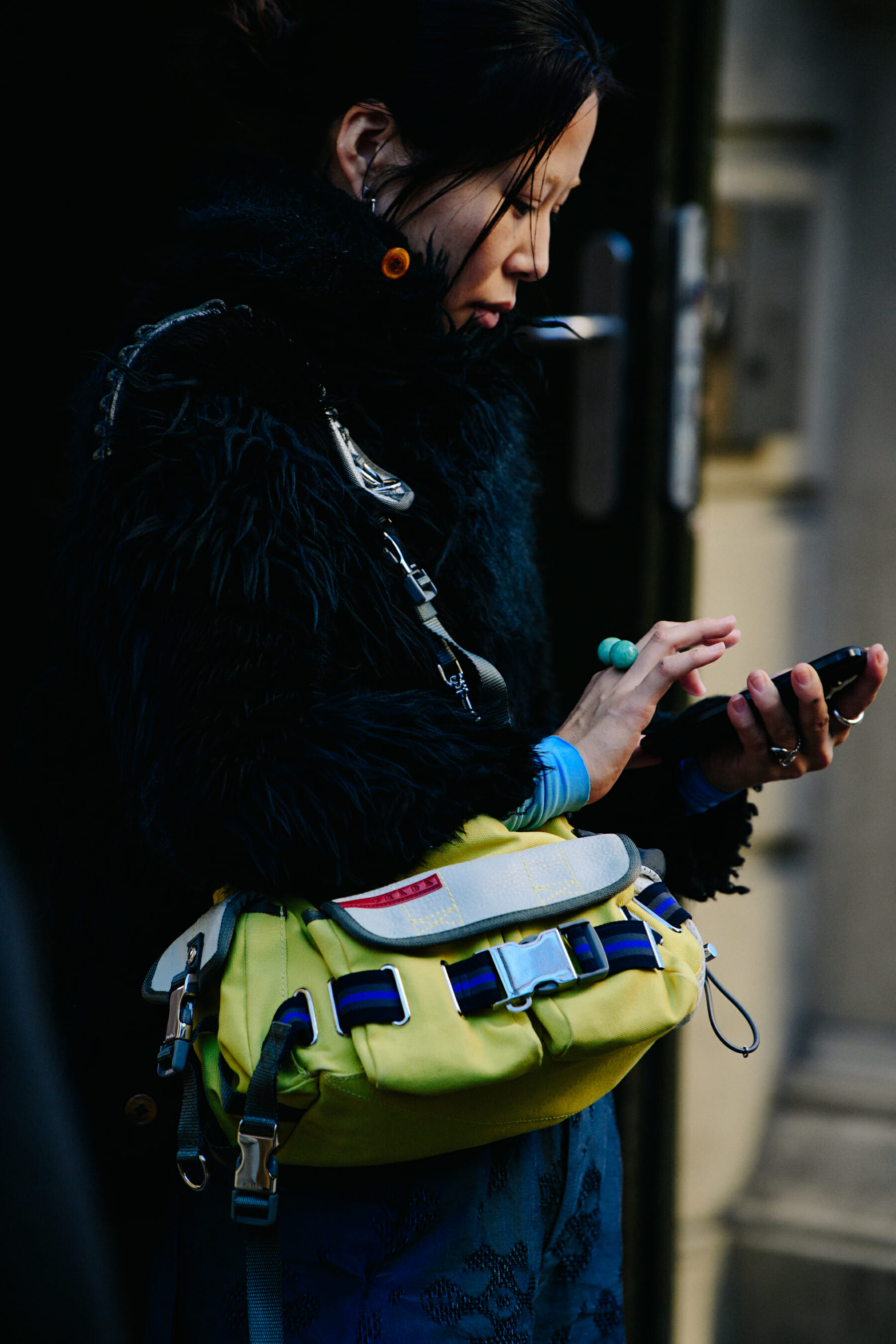 Woman carrying yellow Prada bag