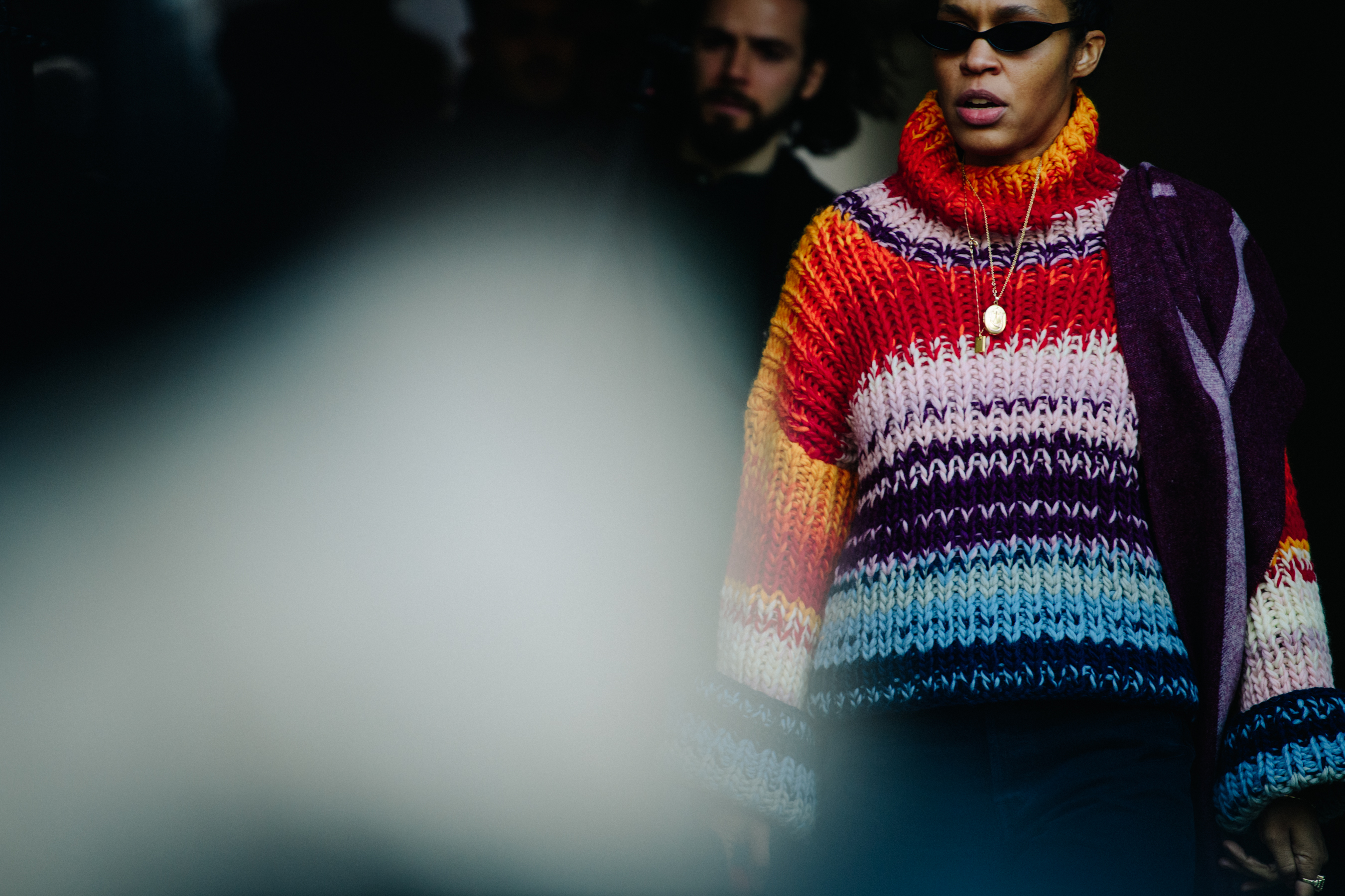 Woman wearing colourful jumper