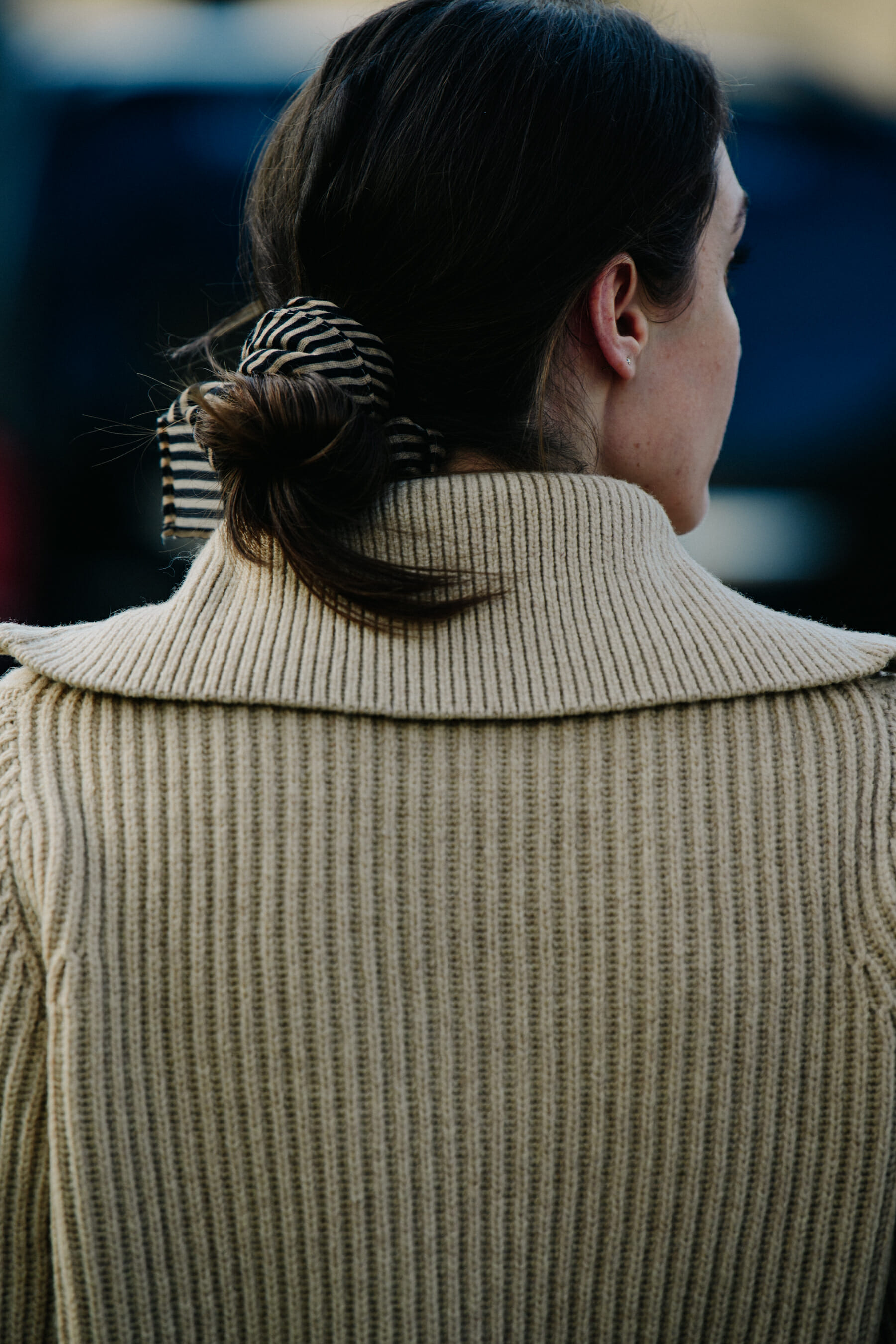 Woman wearing tan jumper