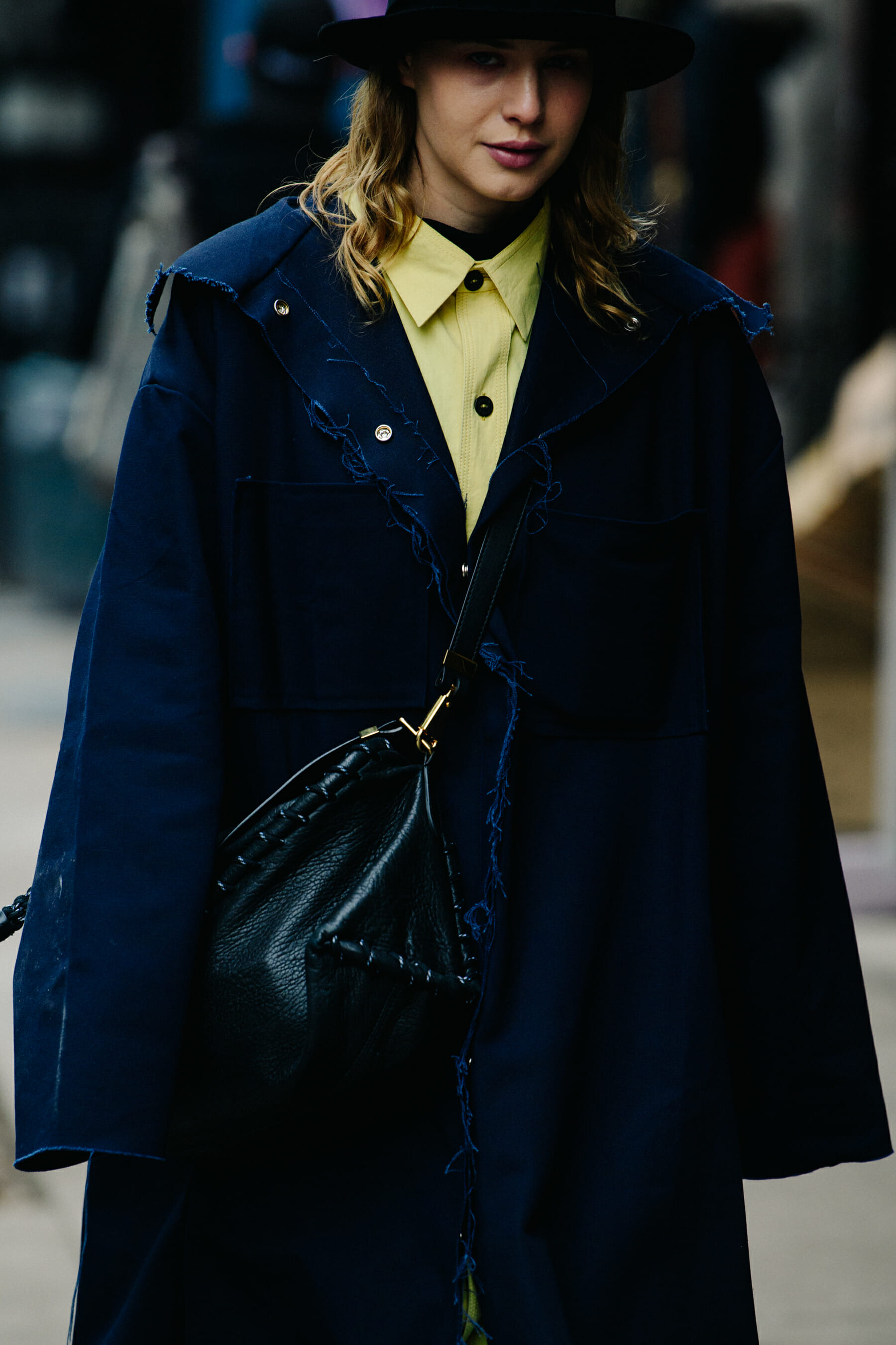 Woman wearing long denim coat