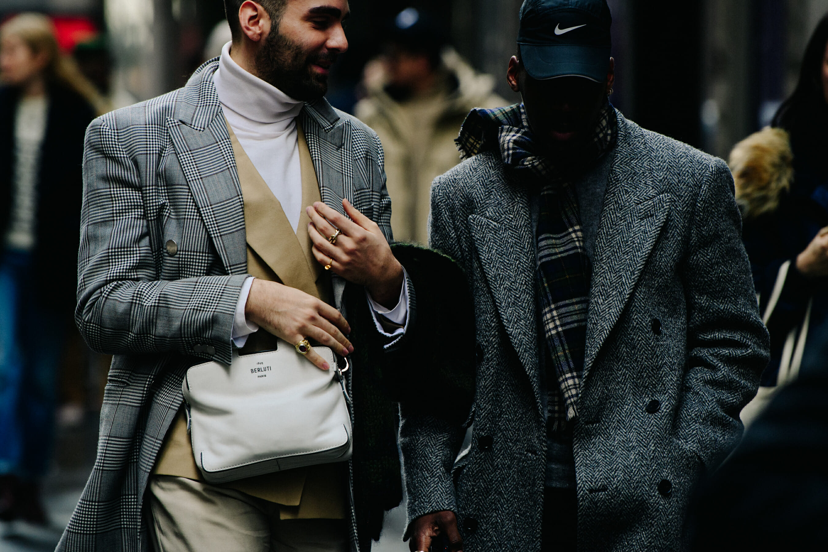 Two men wearing grey