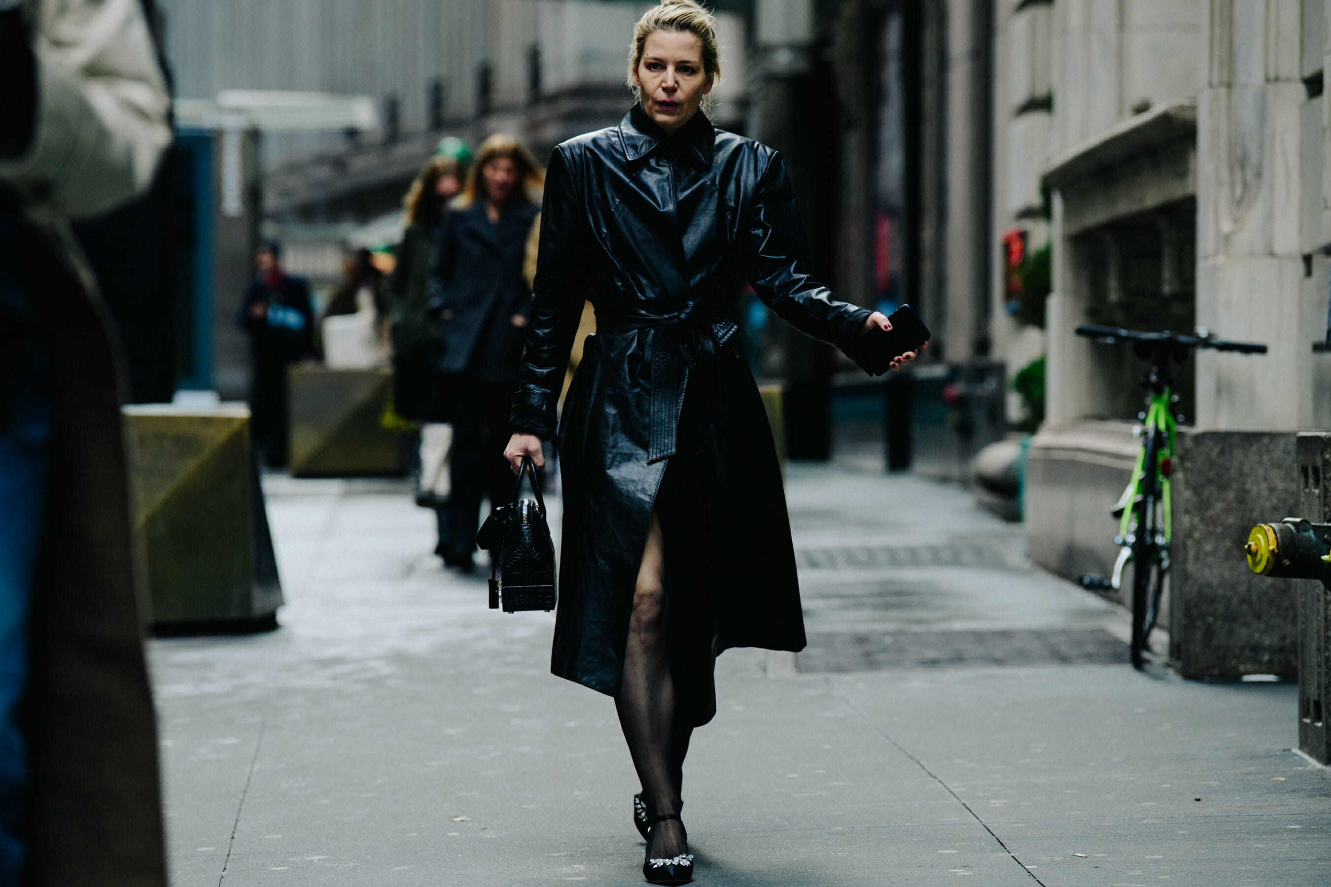 Woman wearing black leather coat