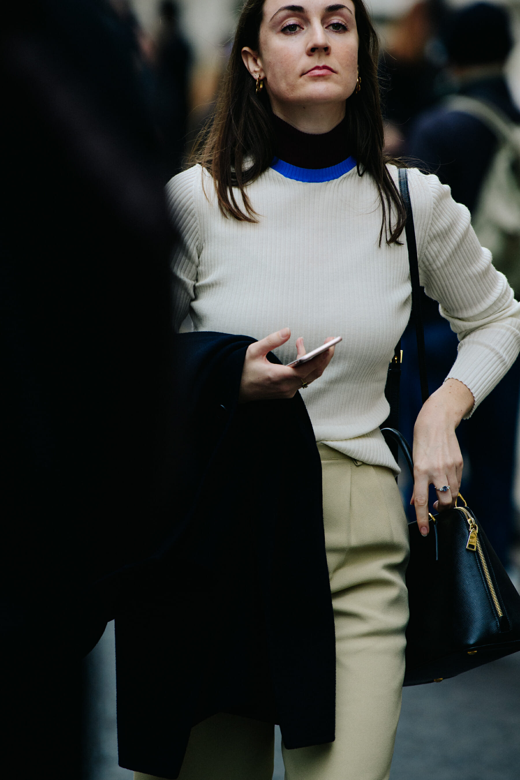 Woman wearing white wool jumper